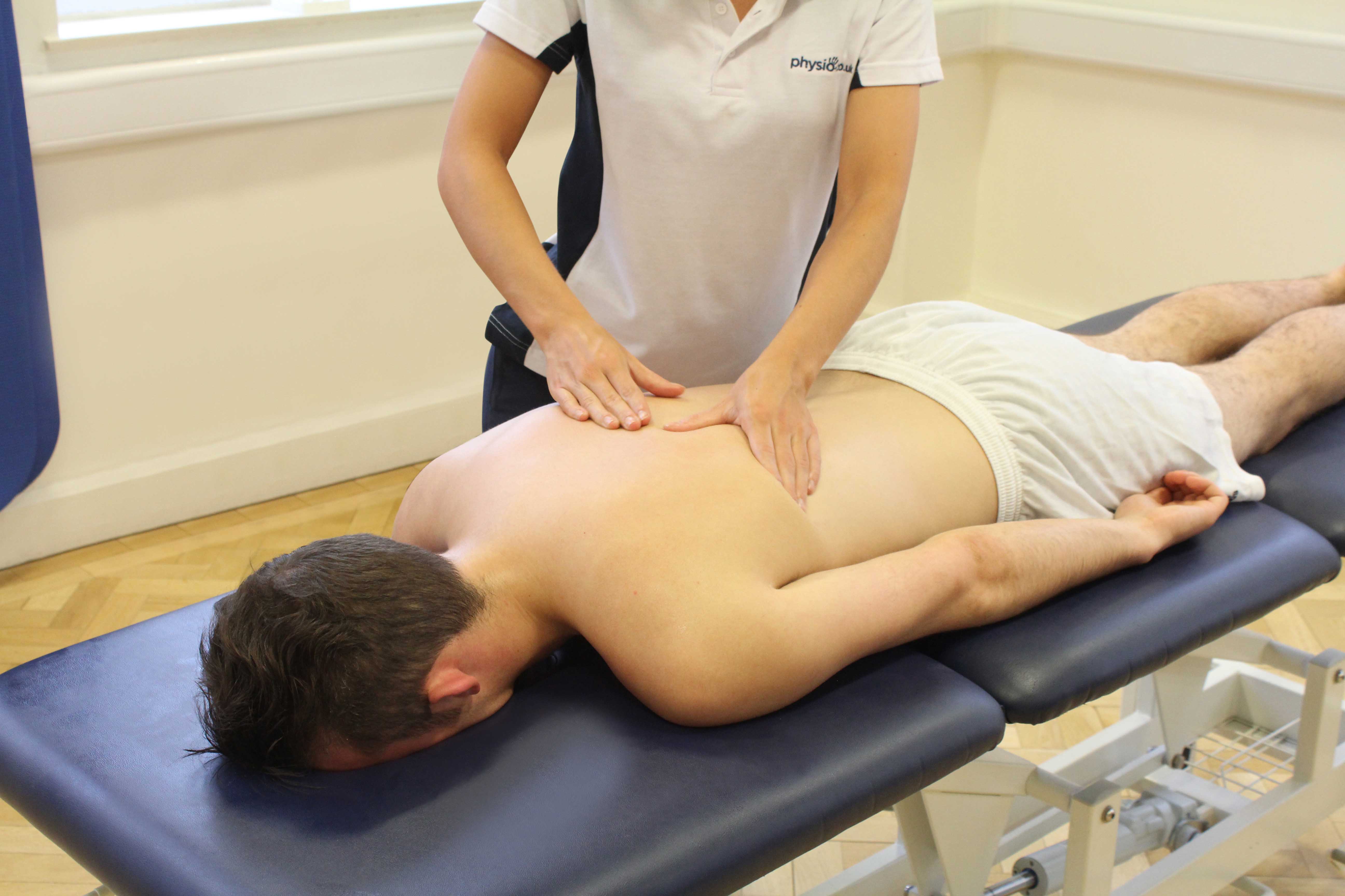 Stretch of the hip flexor muscles applied by a specilaist massage therapist