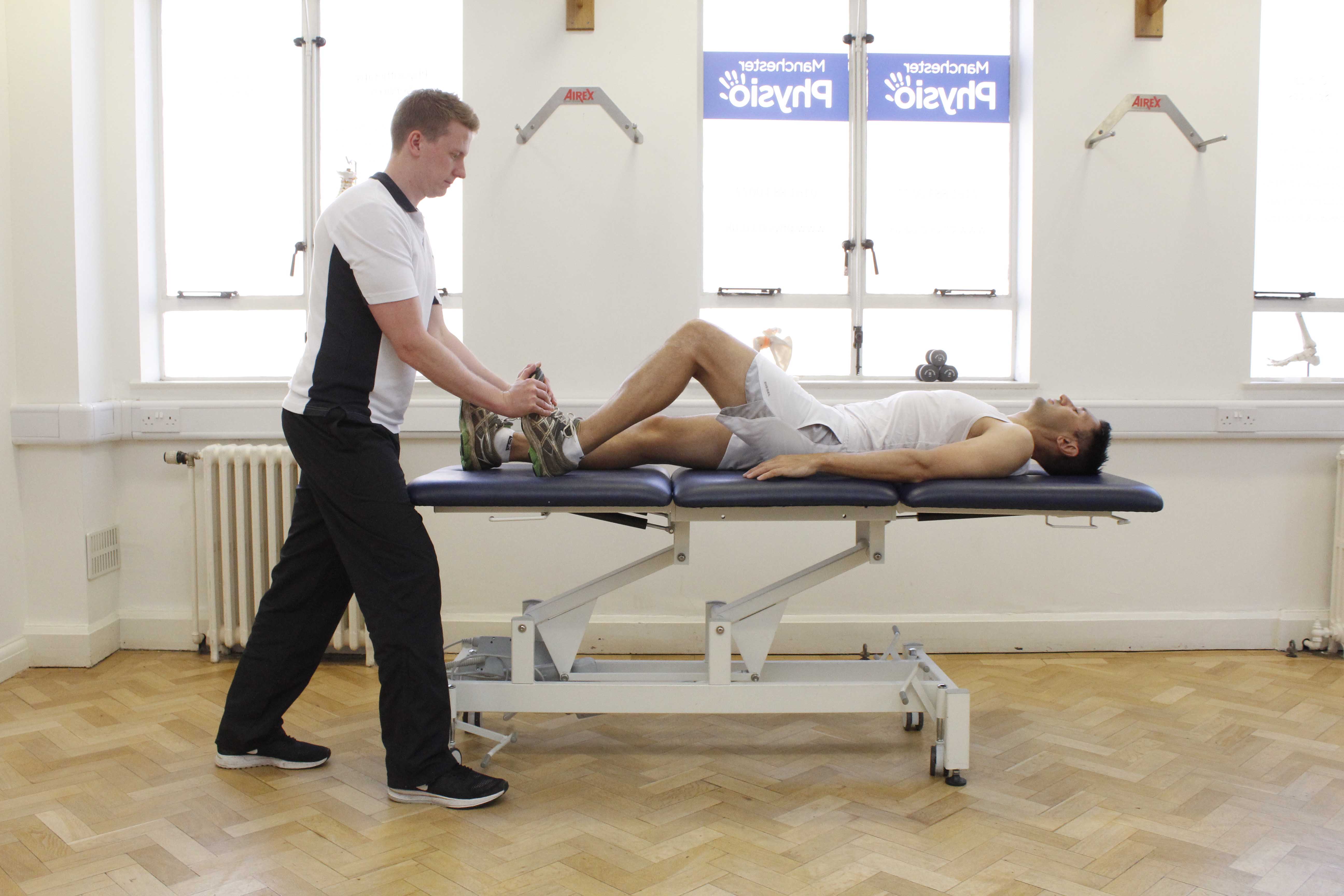 Passive stretch of the achilles tendon performed by specialist therapist