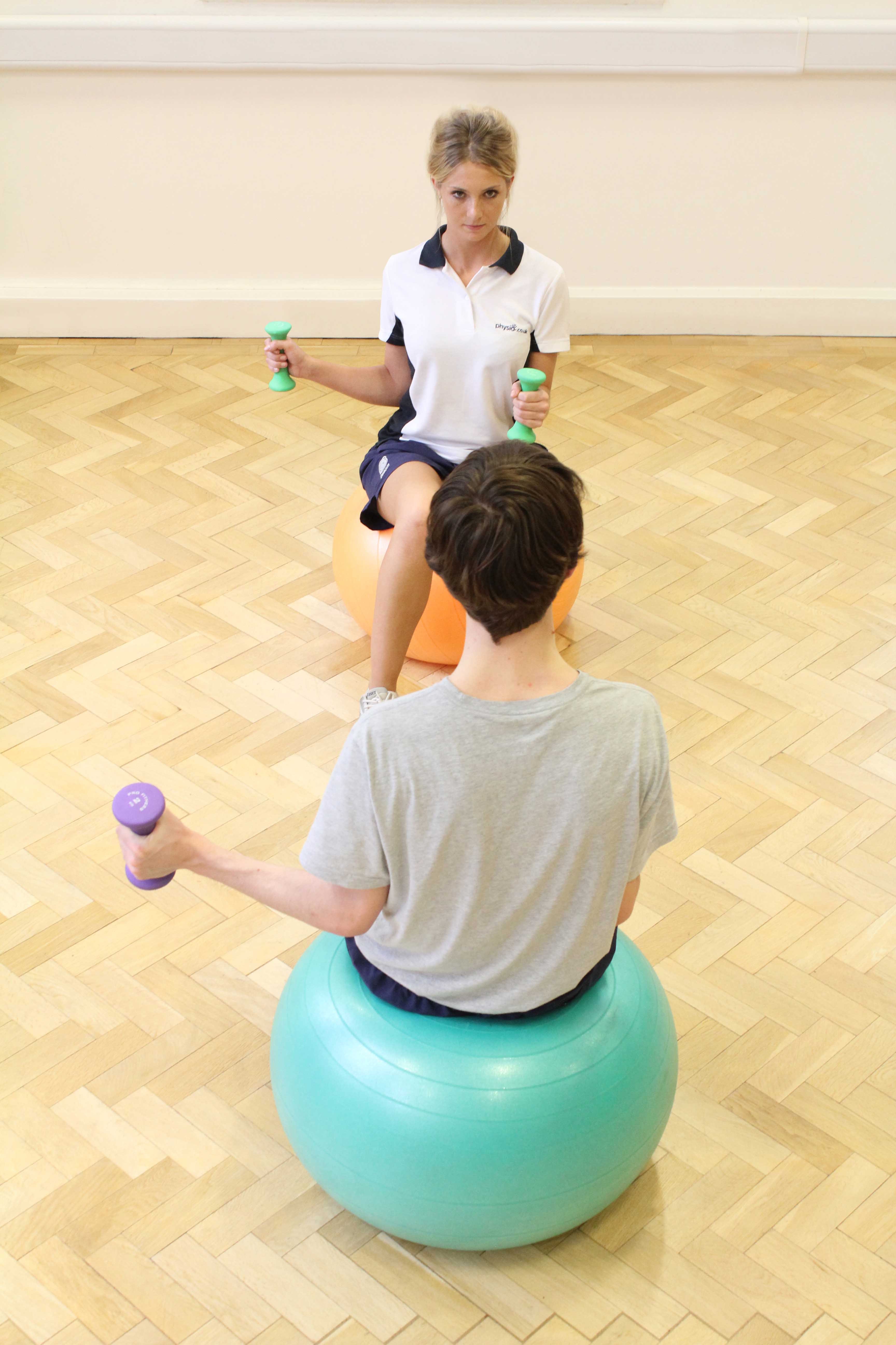 Functional wrist exercises assisted by experienced MSK Physiotherapist