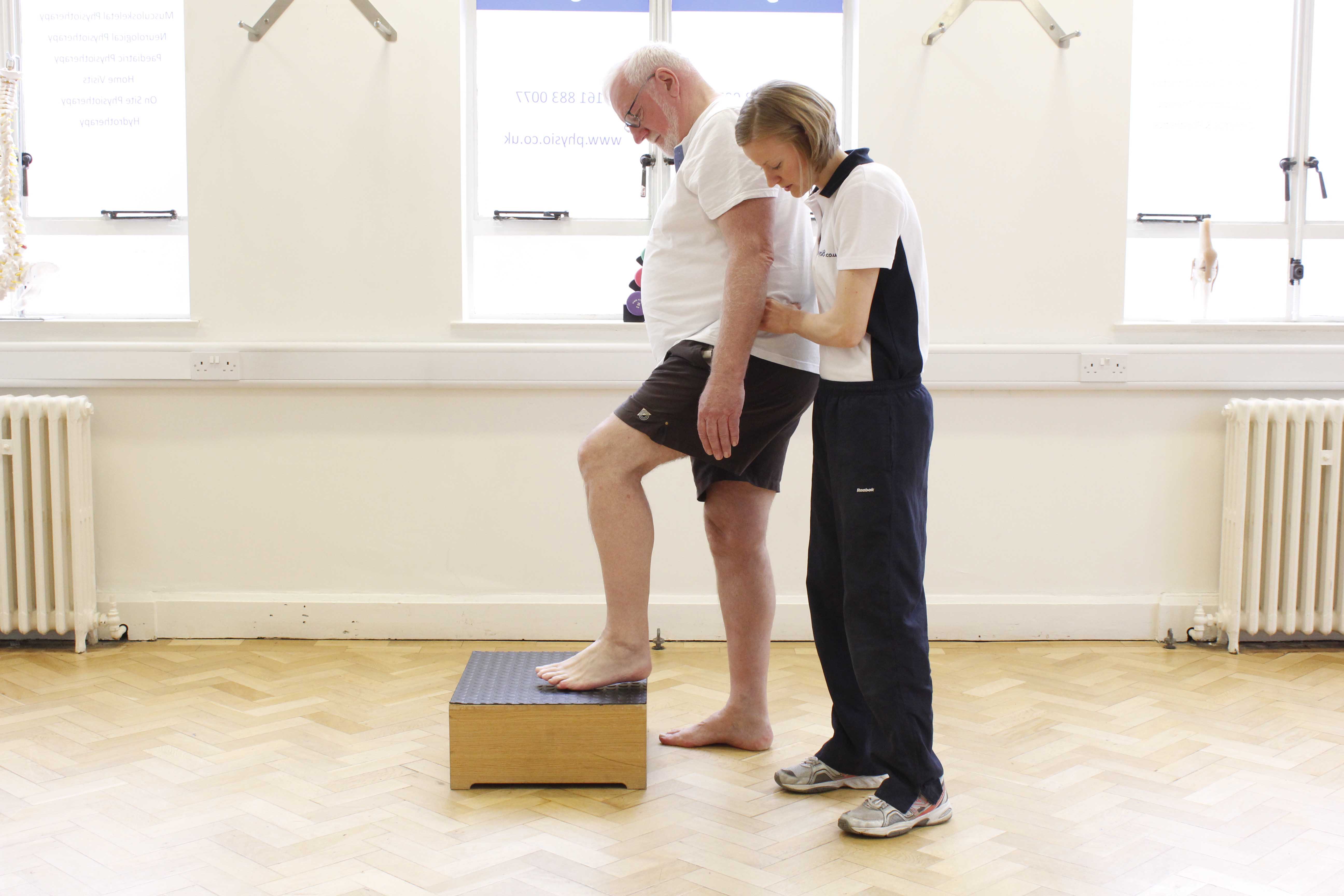 Functional mobility exercises assisted by a specialist neuro physiotherapist