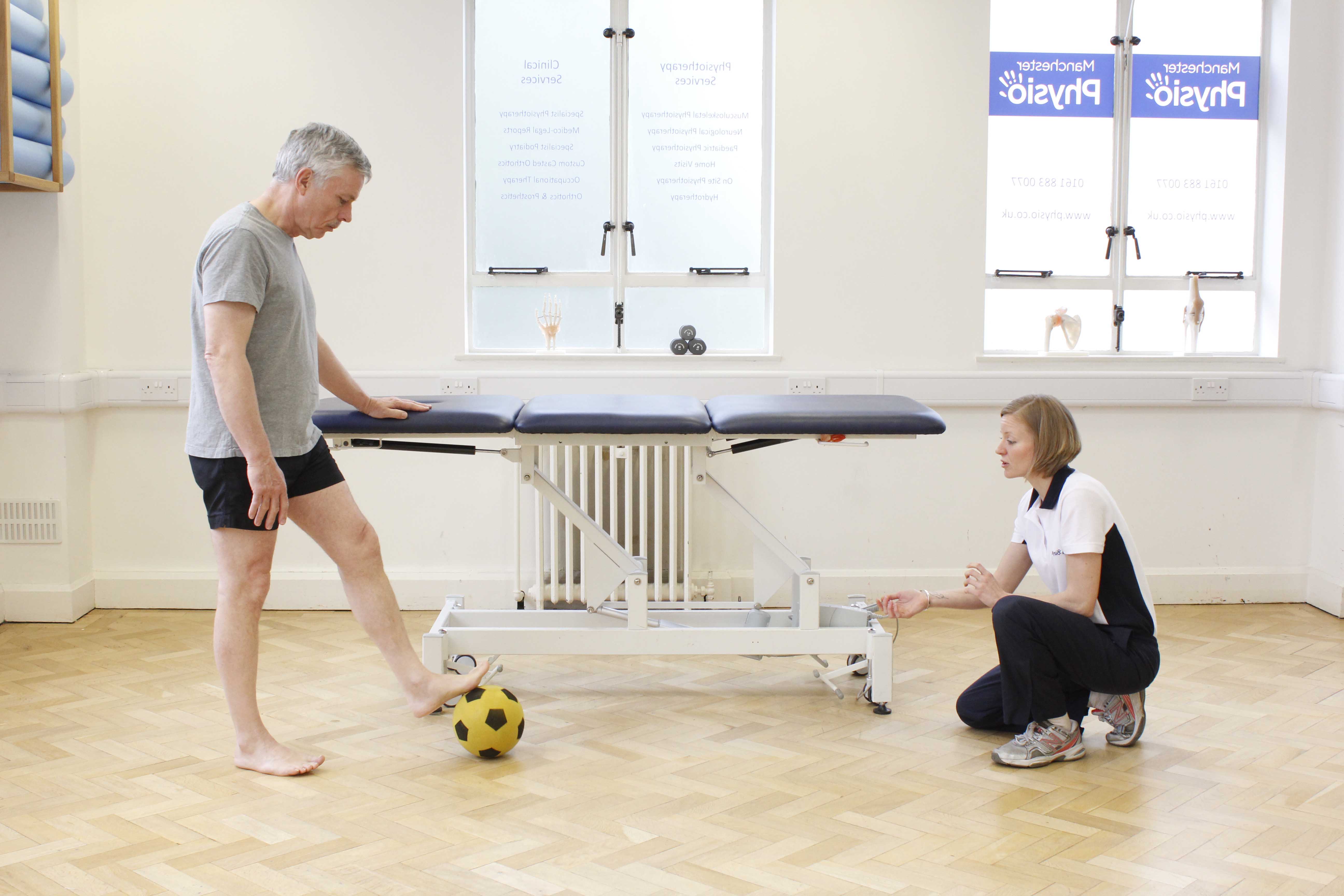 Neurological physiotherapist supervising gross motor skill co-ordination exercises