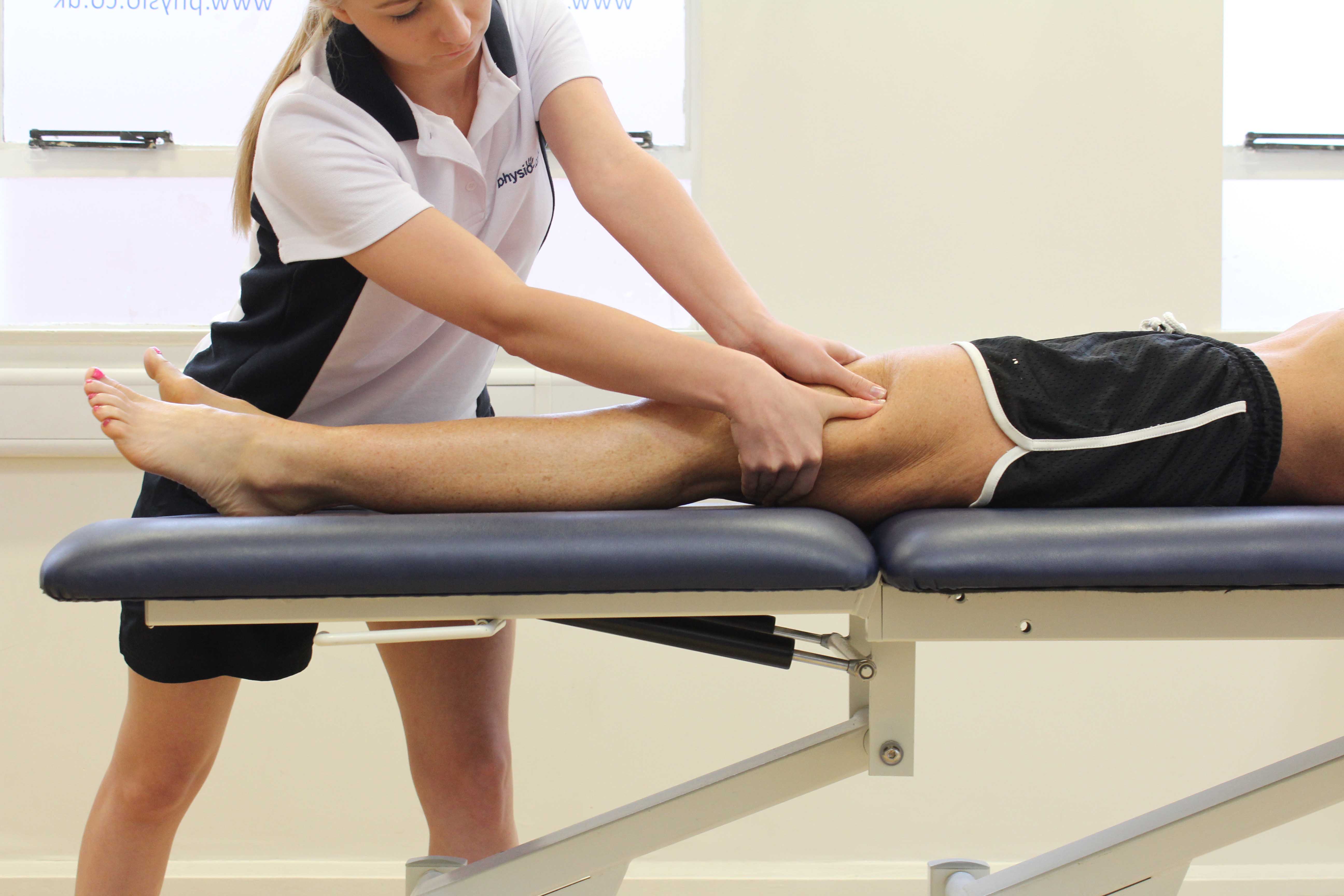 Deep tissue massage of vastus lateralis and illio-tibial band