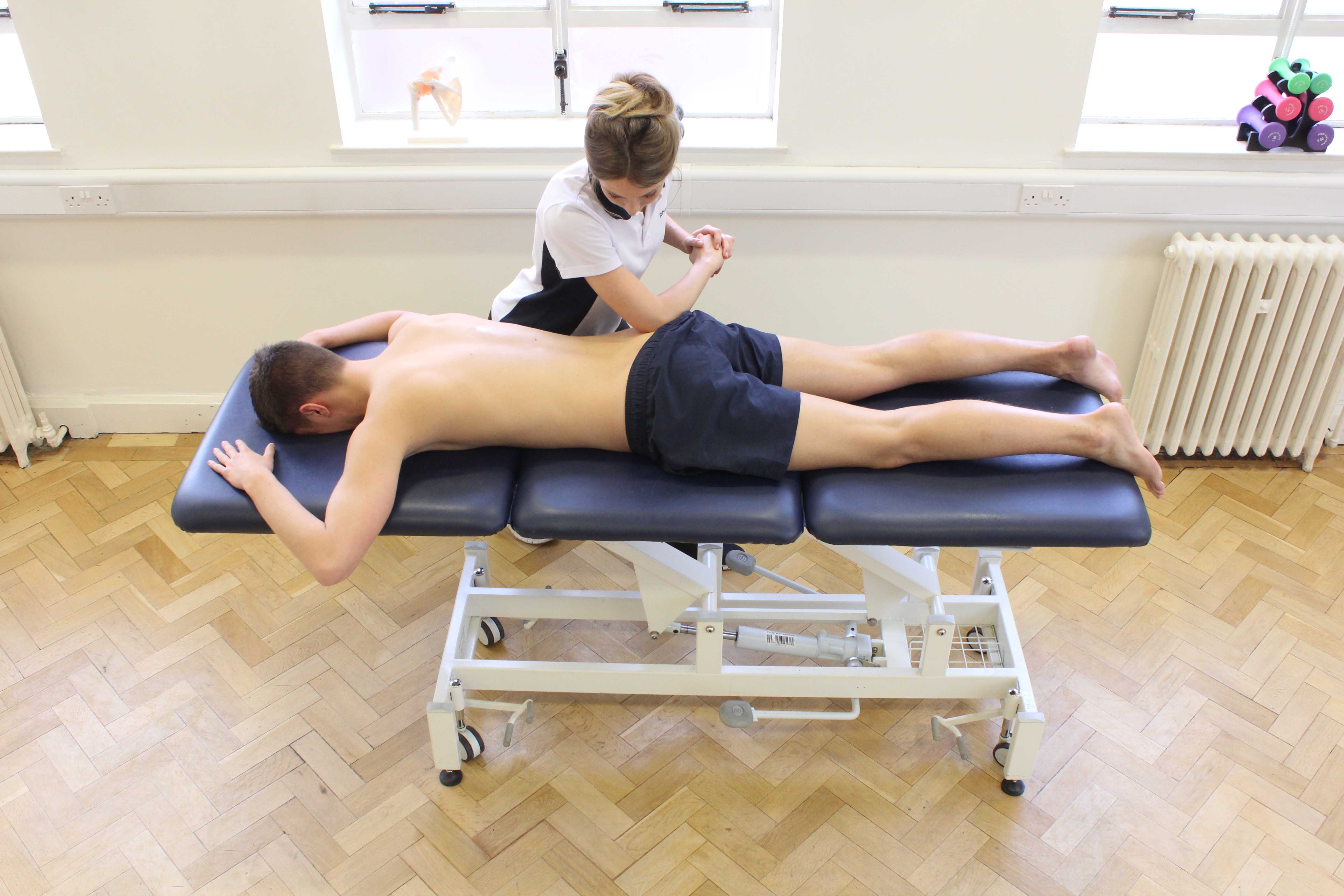 Deep tissue massage of the gluteus maximus muscle by specialist therapist