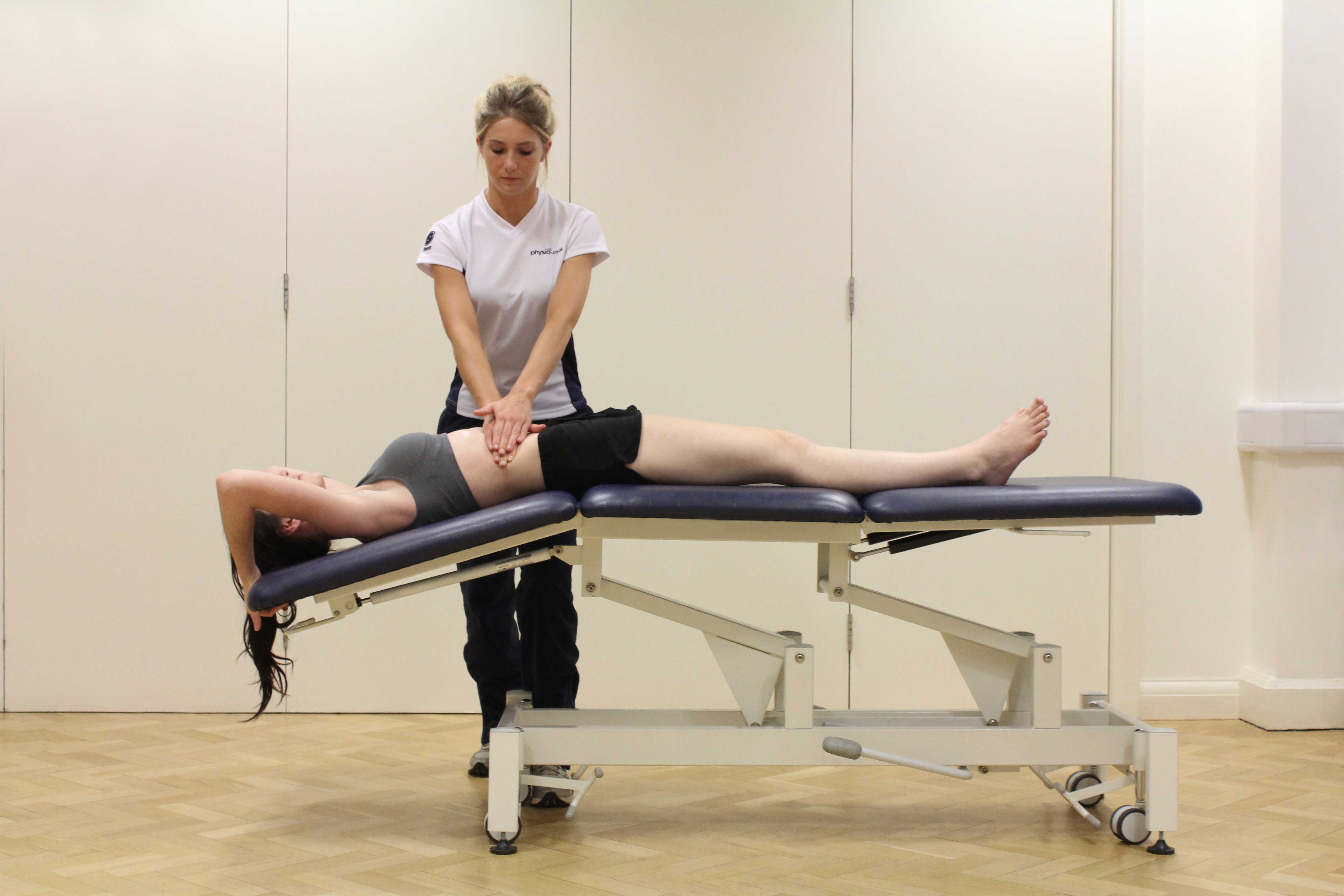 Soft tissue massage of the abdominal muscles by experienced MSK therapist