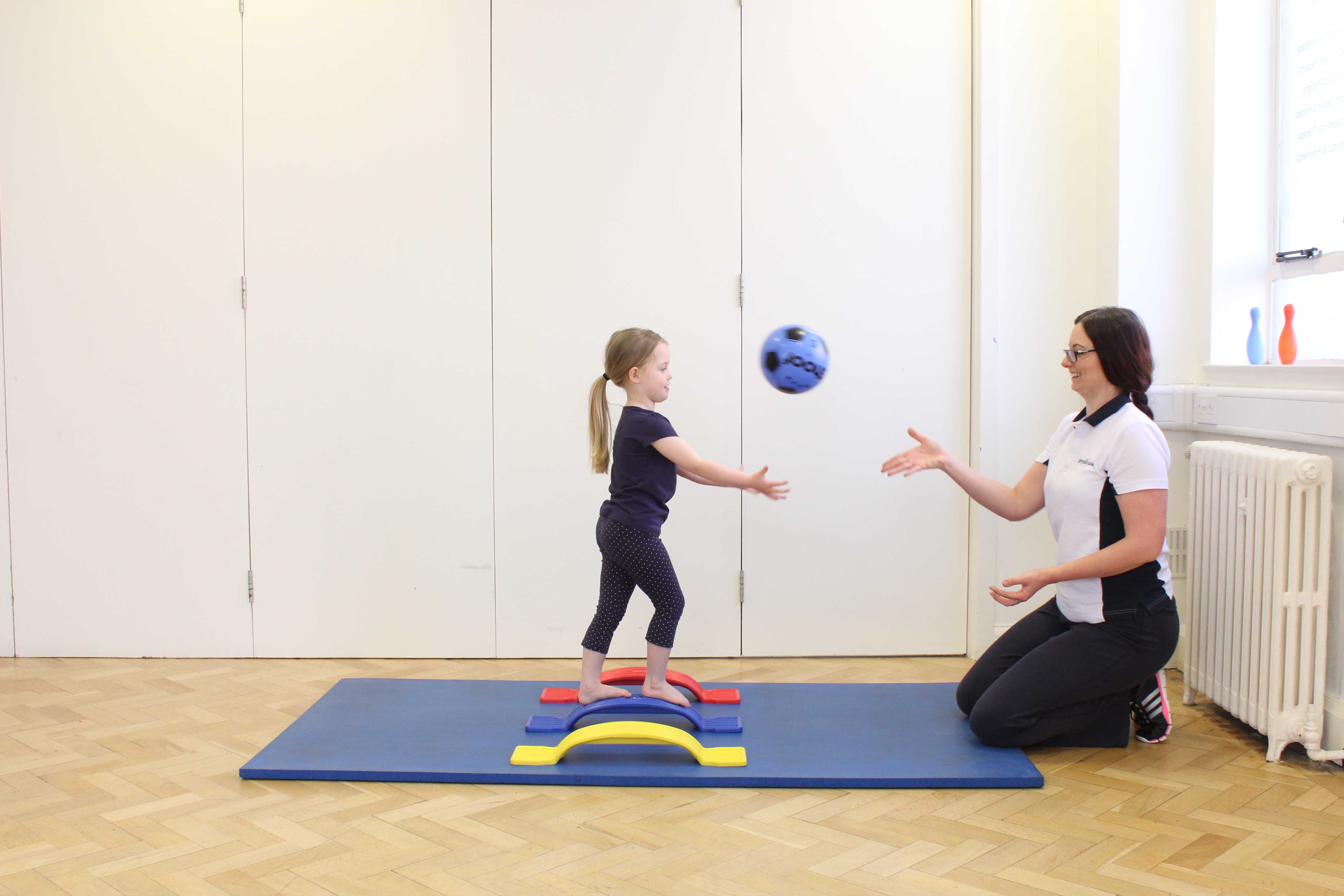 Balance and co-ordination rehabilitation exercises assisted by a paediatric physiotherapist Balance and co-ordination rehabilitation exercises assisted by a paediatric physiotherapist