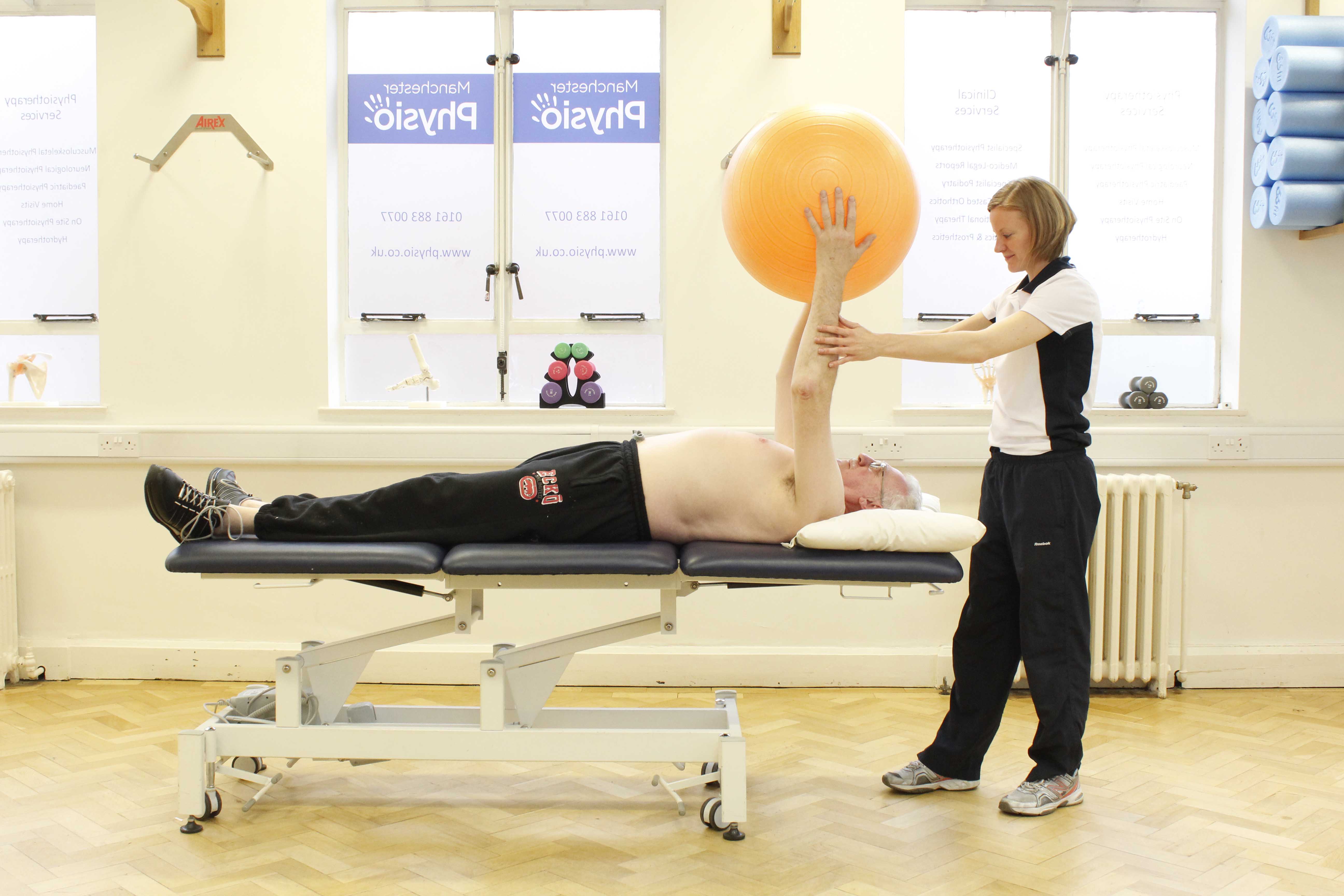 Upper limb mobility exercises using a gym ball assisted by a physiotherapist Upper limb mobility exercises using a gym ball assisted by a physiotherapist