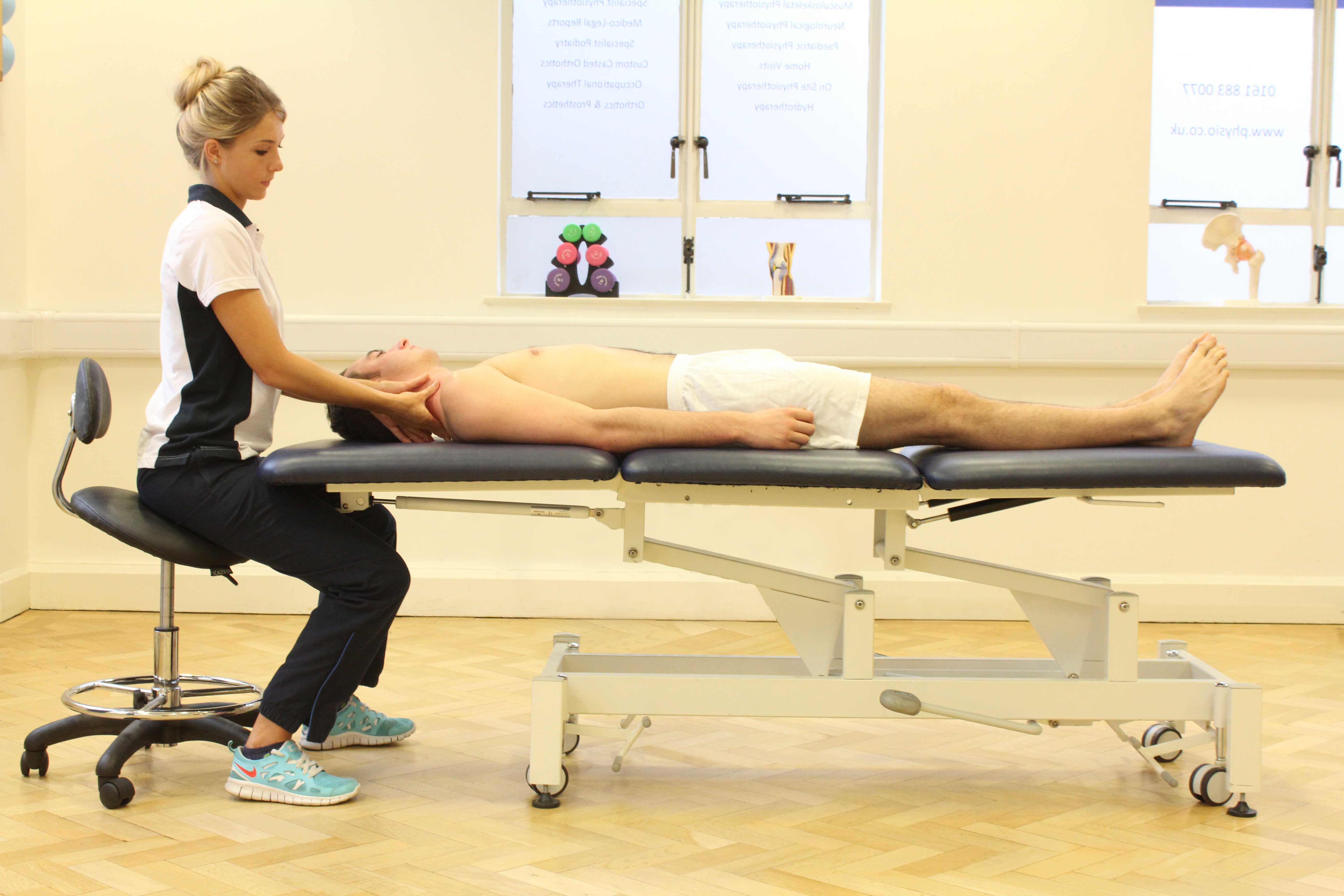 Soft tissue massage of the muscle and connective tissues in the neck Soft tissue massage of the muscle and connective tissues in the neck