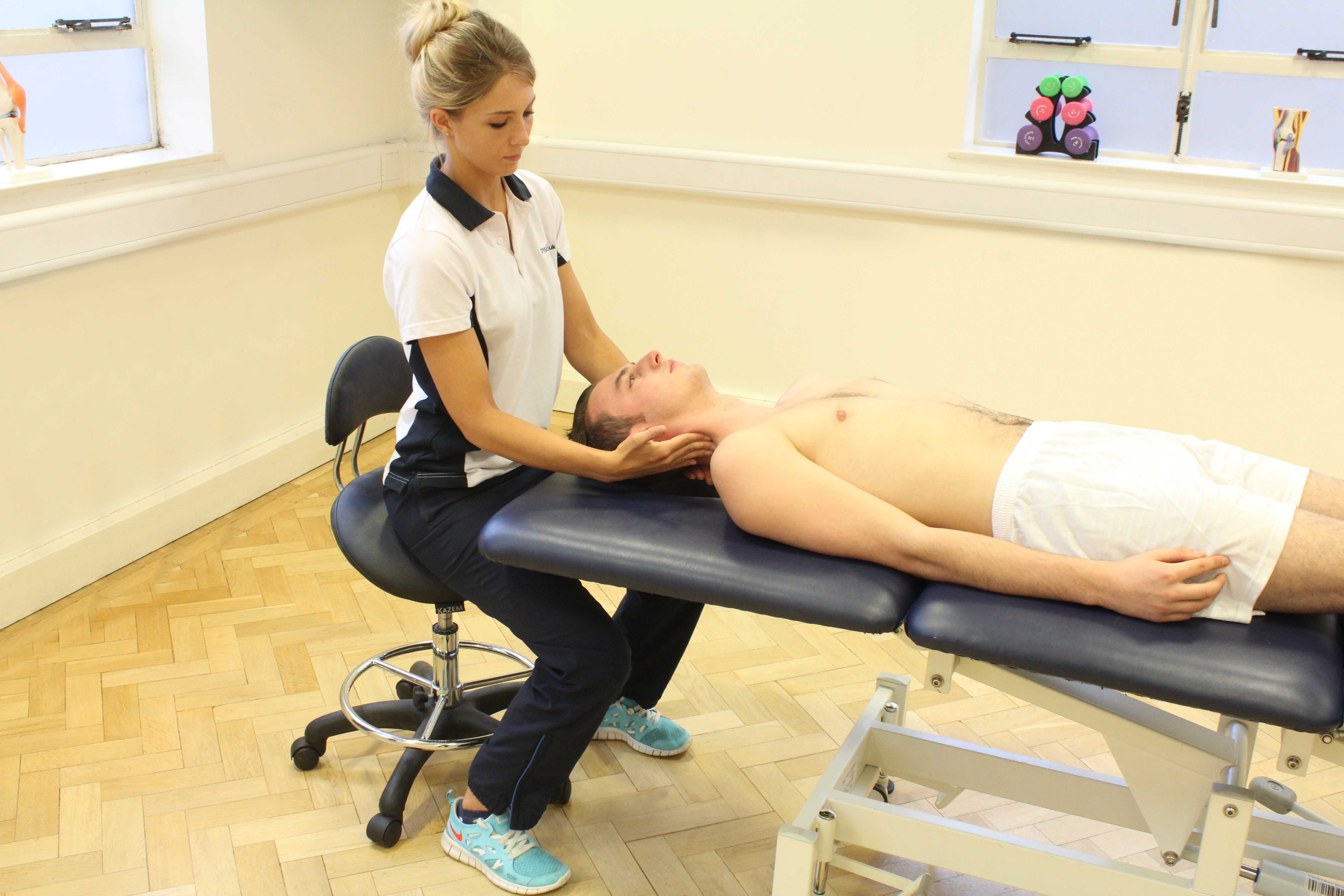 Soft tissue massage of sternocliedomastoid muscles in neck Soft tissue massage of sternocliedomastoid muscles in neck