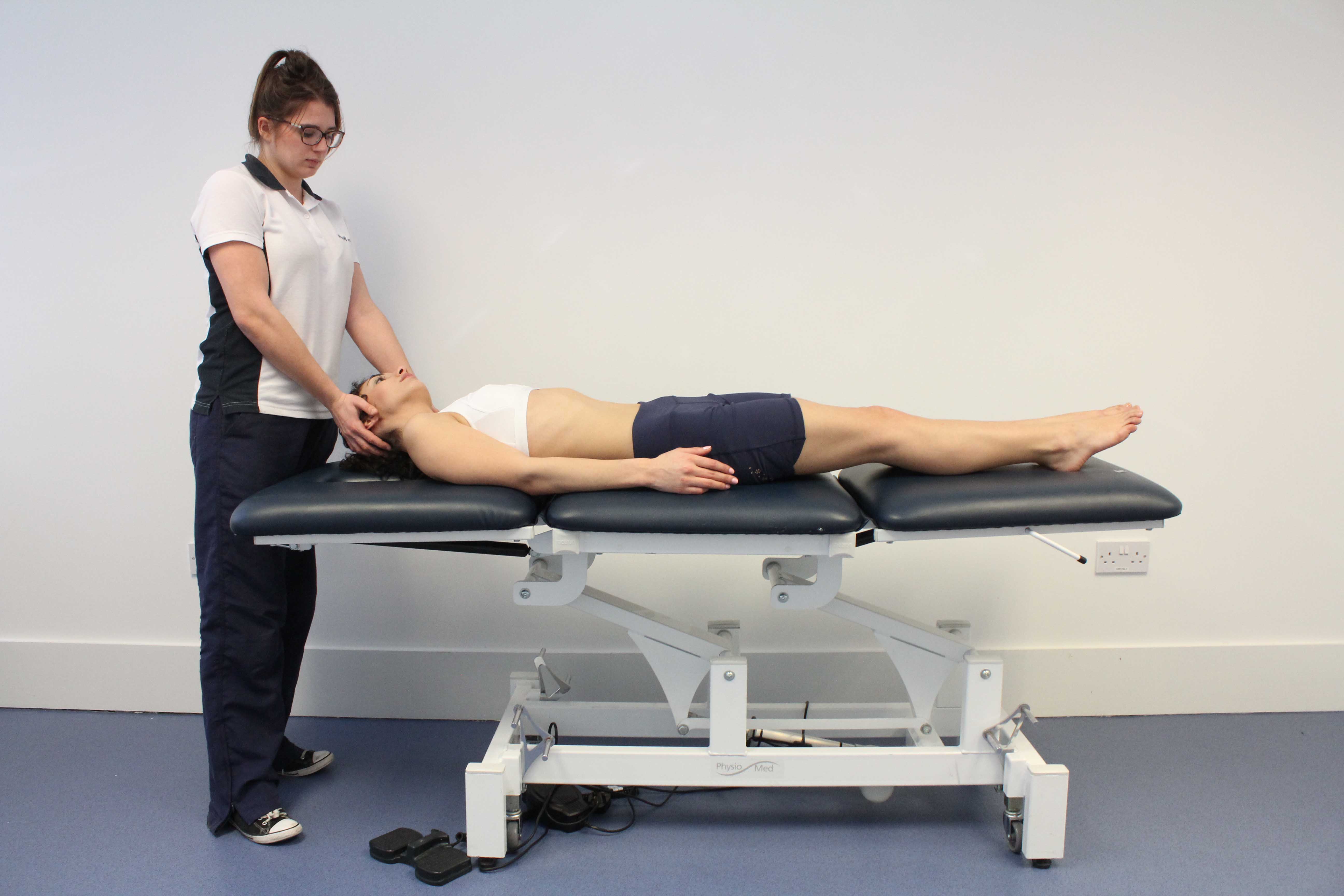Stretches and massage applied to the cervical spine to relieve stiffness and pain Stretches and massage applied to the cervical spine to relieve stiffness and pain
