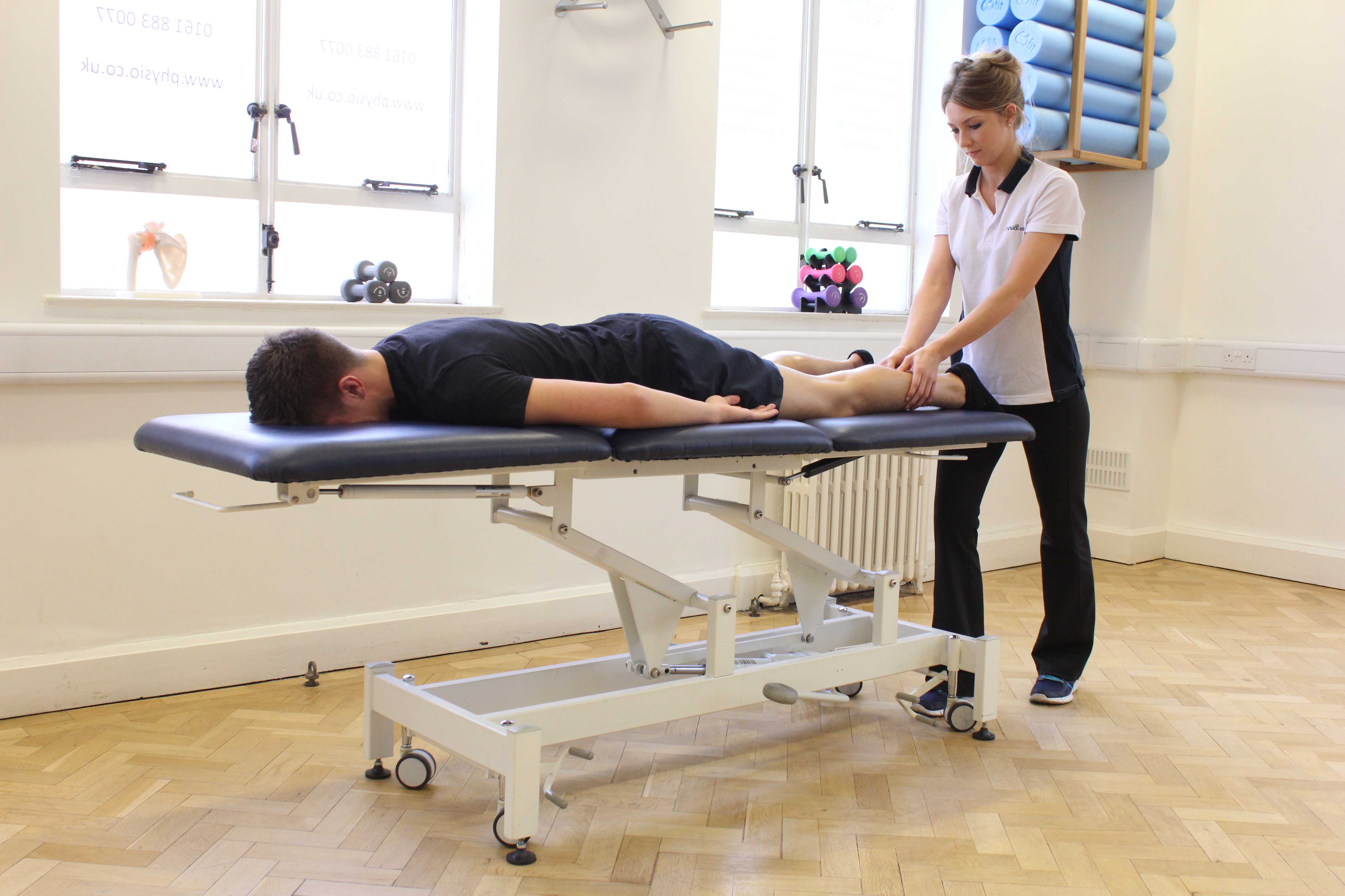 Trigger point massage technique applied to the gastroc nemius muscle to relieve pain and stiffness Trigger point massage technique applied to the gastroc nemius muscle to relieve pain and stiffness