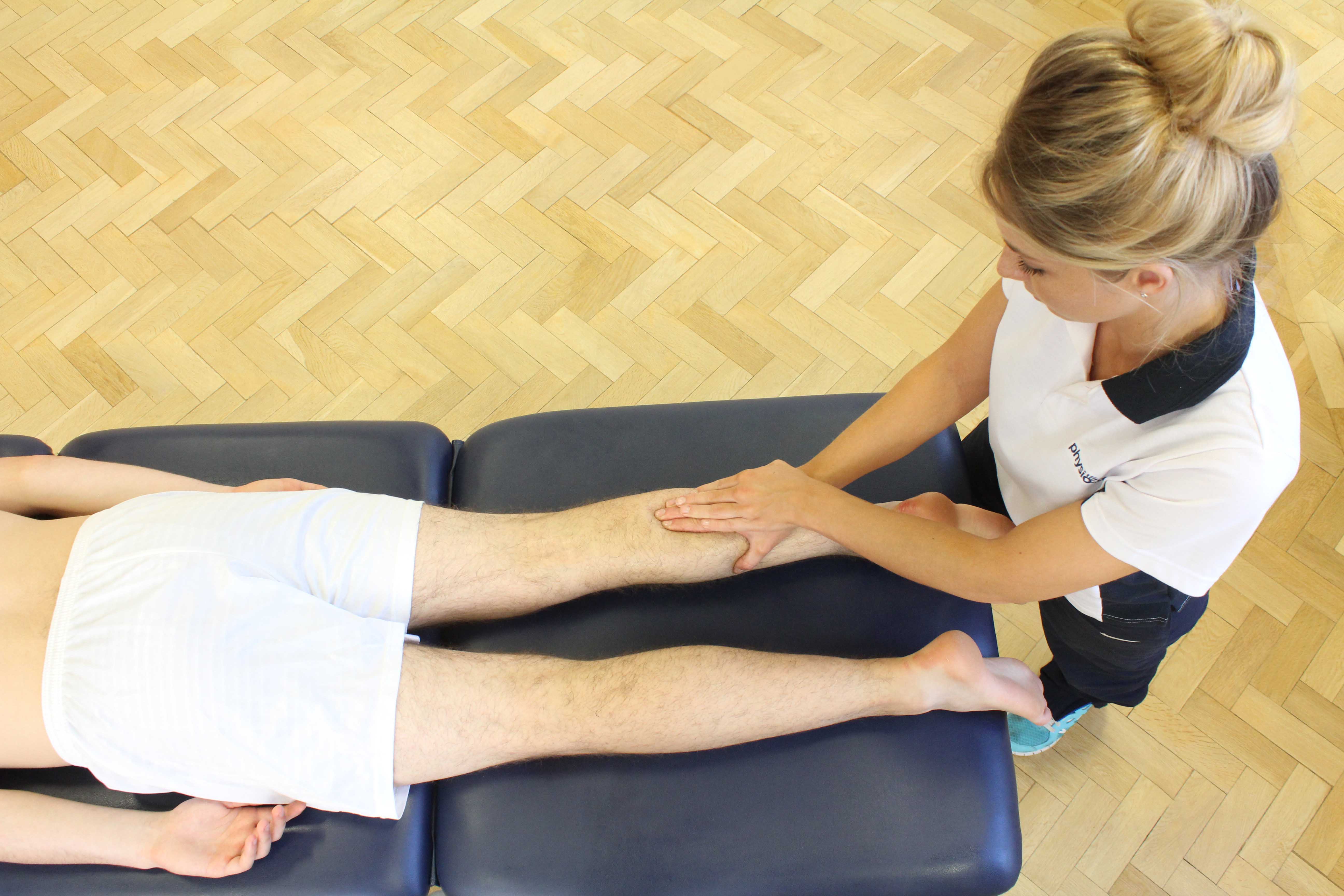 Soft tissue massage of the gastrocnemius muscle by MSK therapist Soft tissue massage of the gastrocnemius muscle by MSK therapist