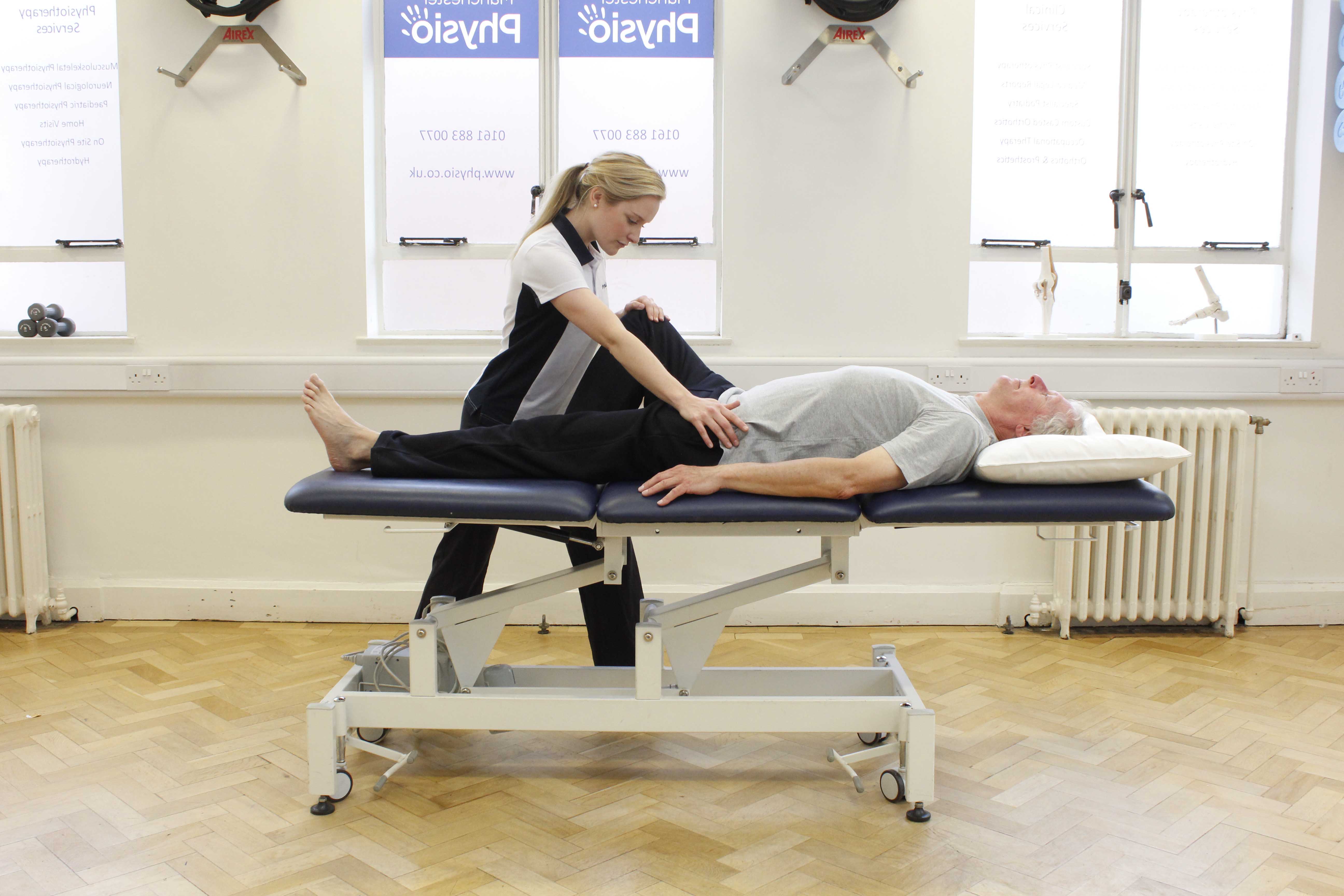 Pelvis and hip abduction stretches assisted by specialist physiotherapist Pelvis and hip abduction stretches assisted by specialist physiotherapist