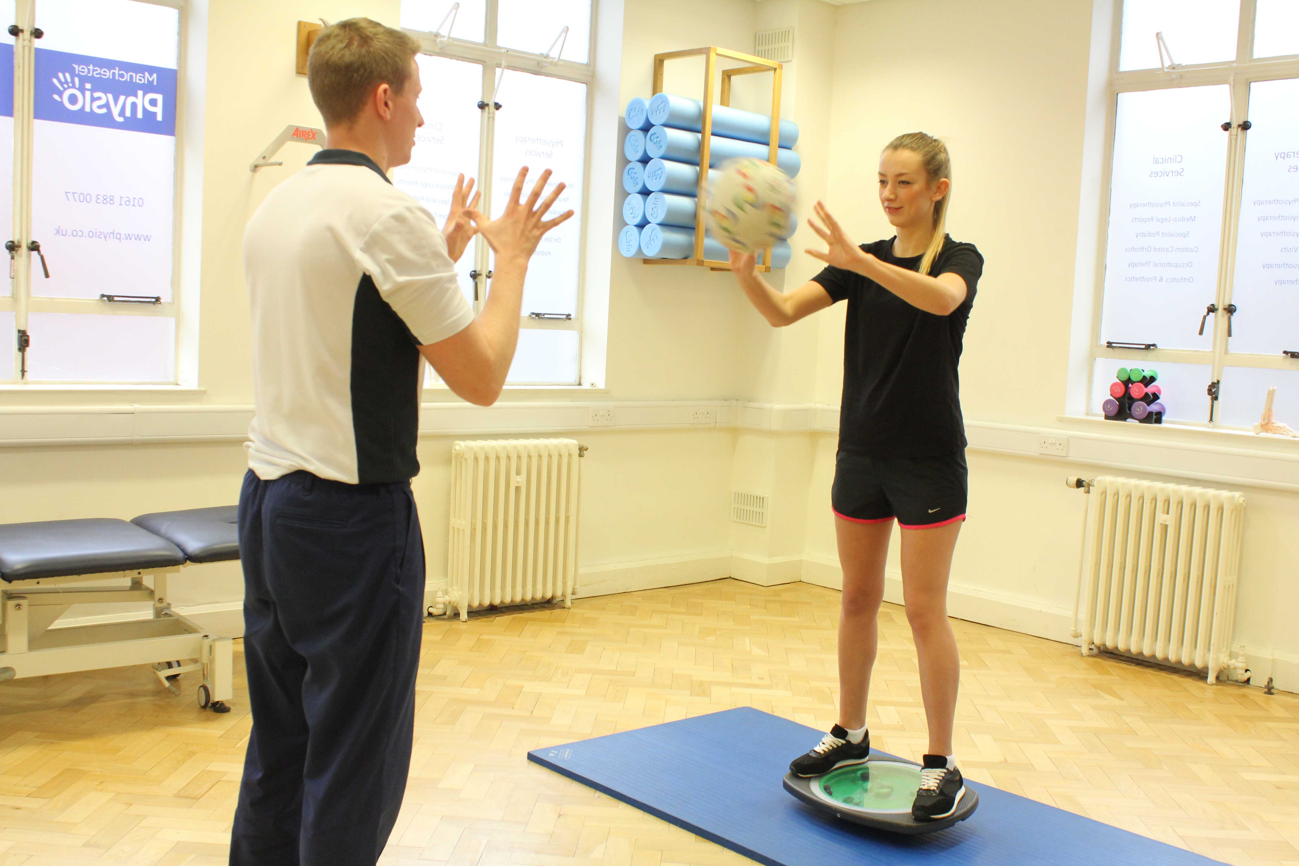 Dynamic balance and co-ordination exercises assisted by an experienced Physiotherapist