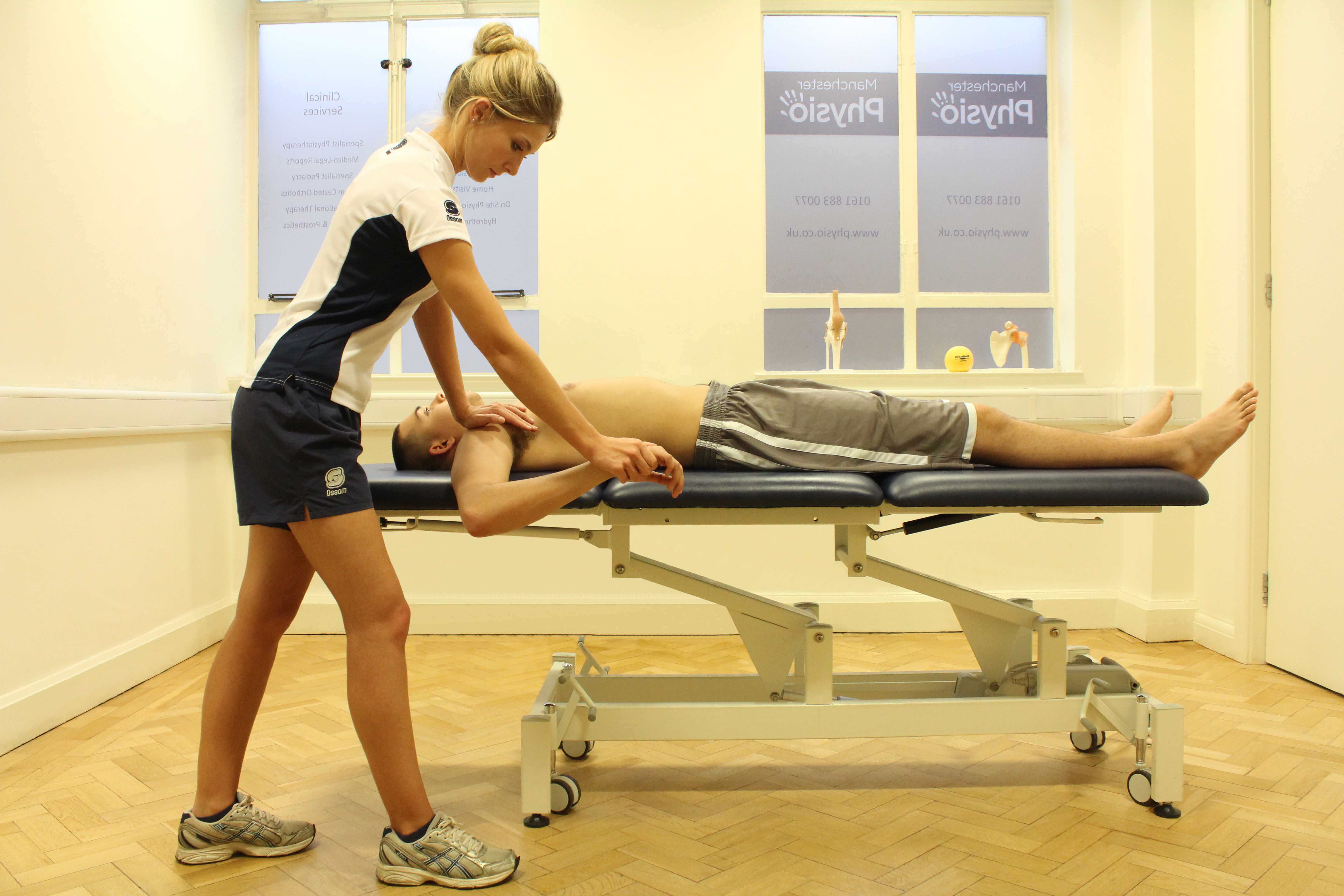 Passive stretches and mobilisations of the elbow by MSK therapist