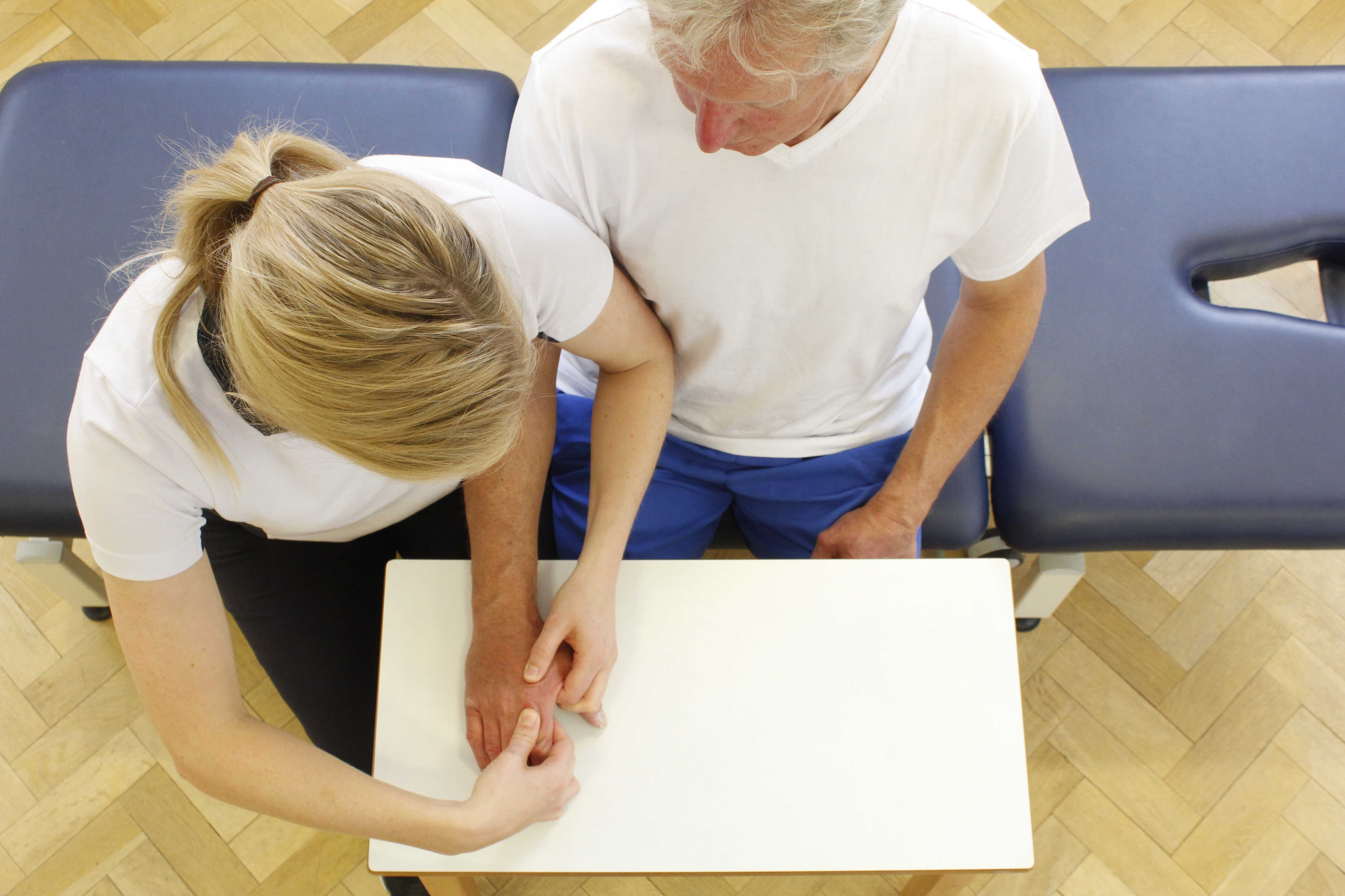 Hand and wrist mobilisations performed by a specialist Physiotherapist