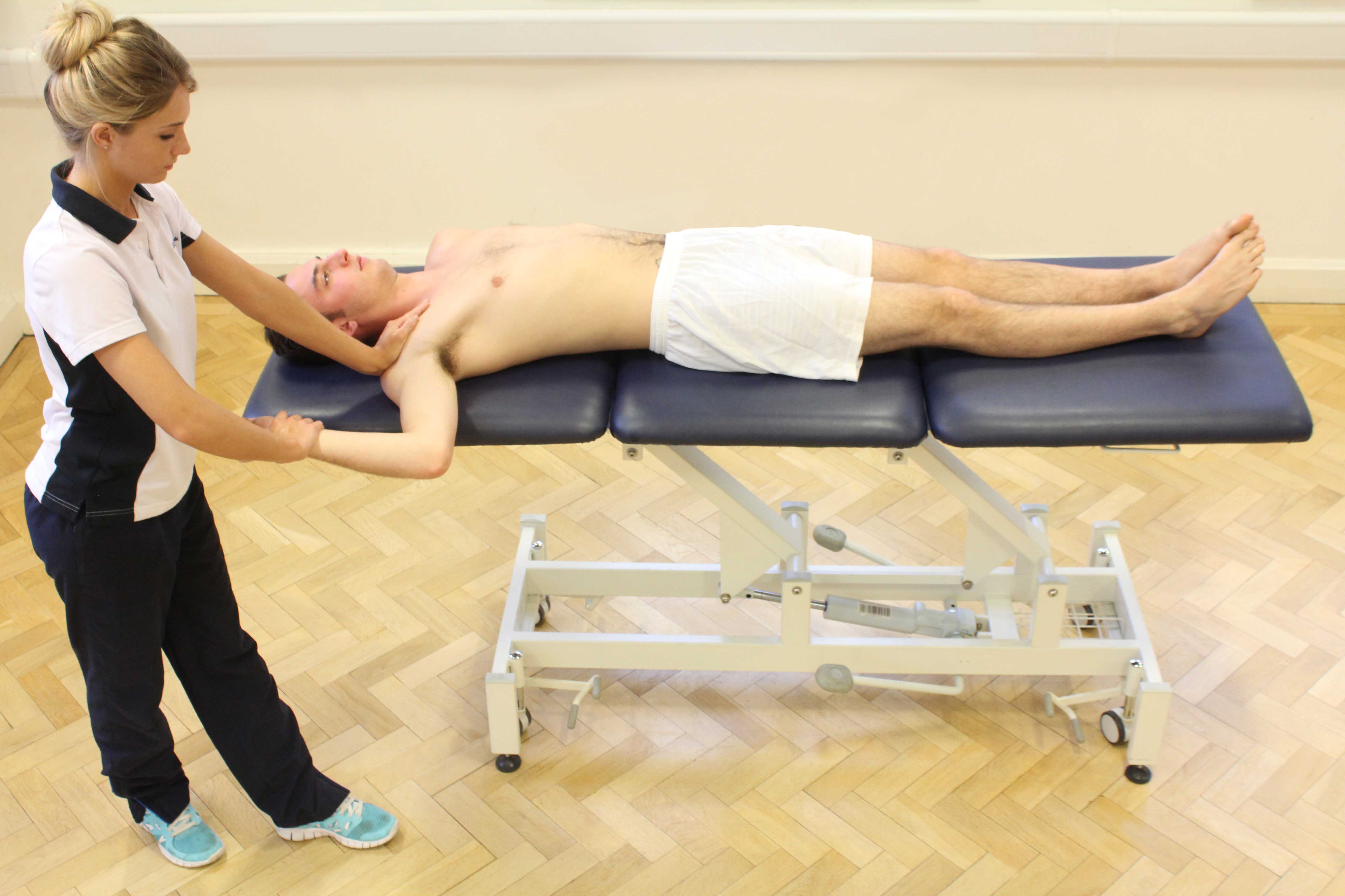 Passive stretches and mobilisations of the elbow by MSK therapist