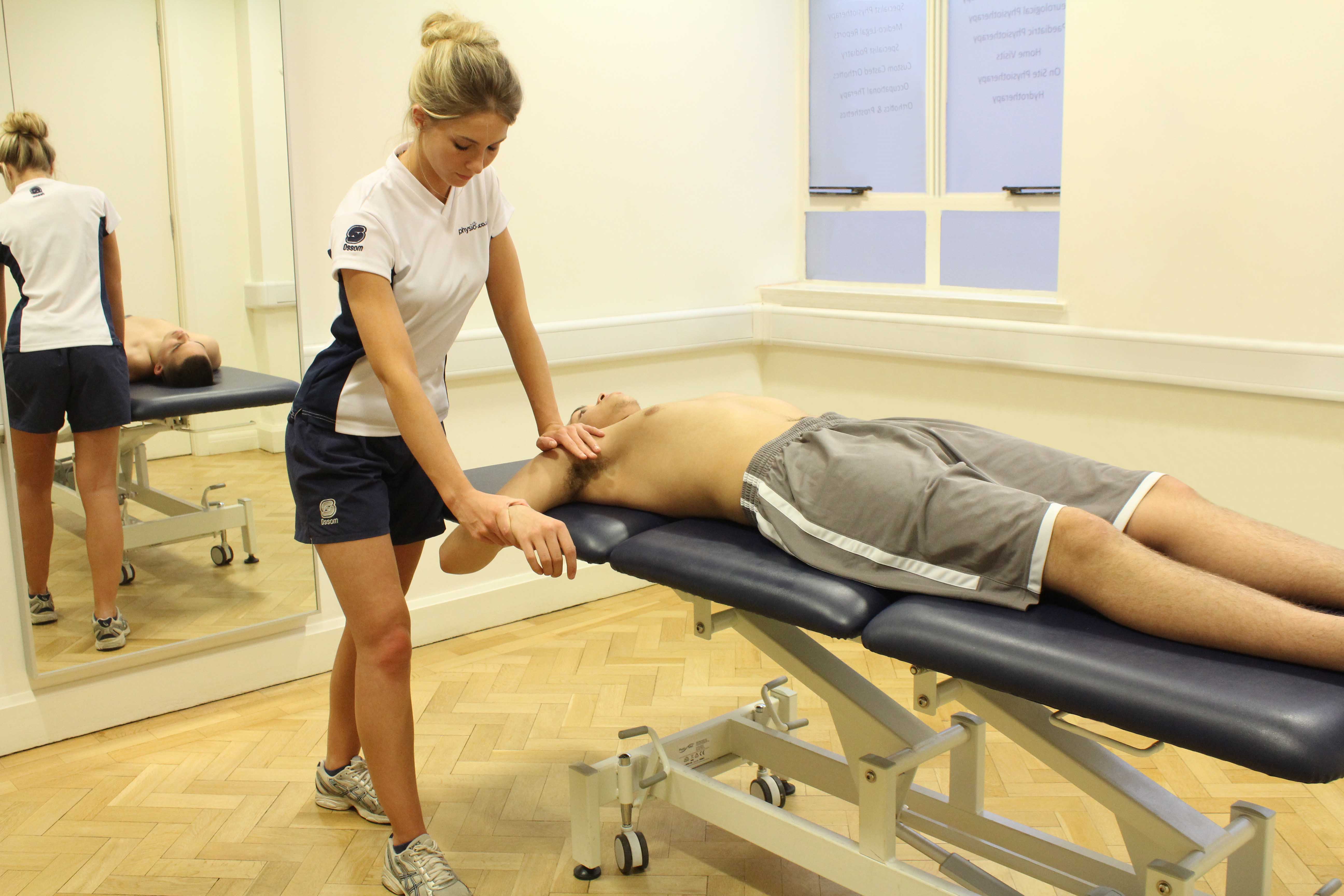 Passive stretches and mobilisations of the elbow by MSK therapist