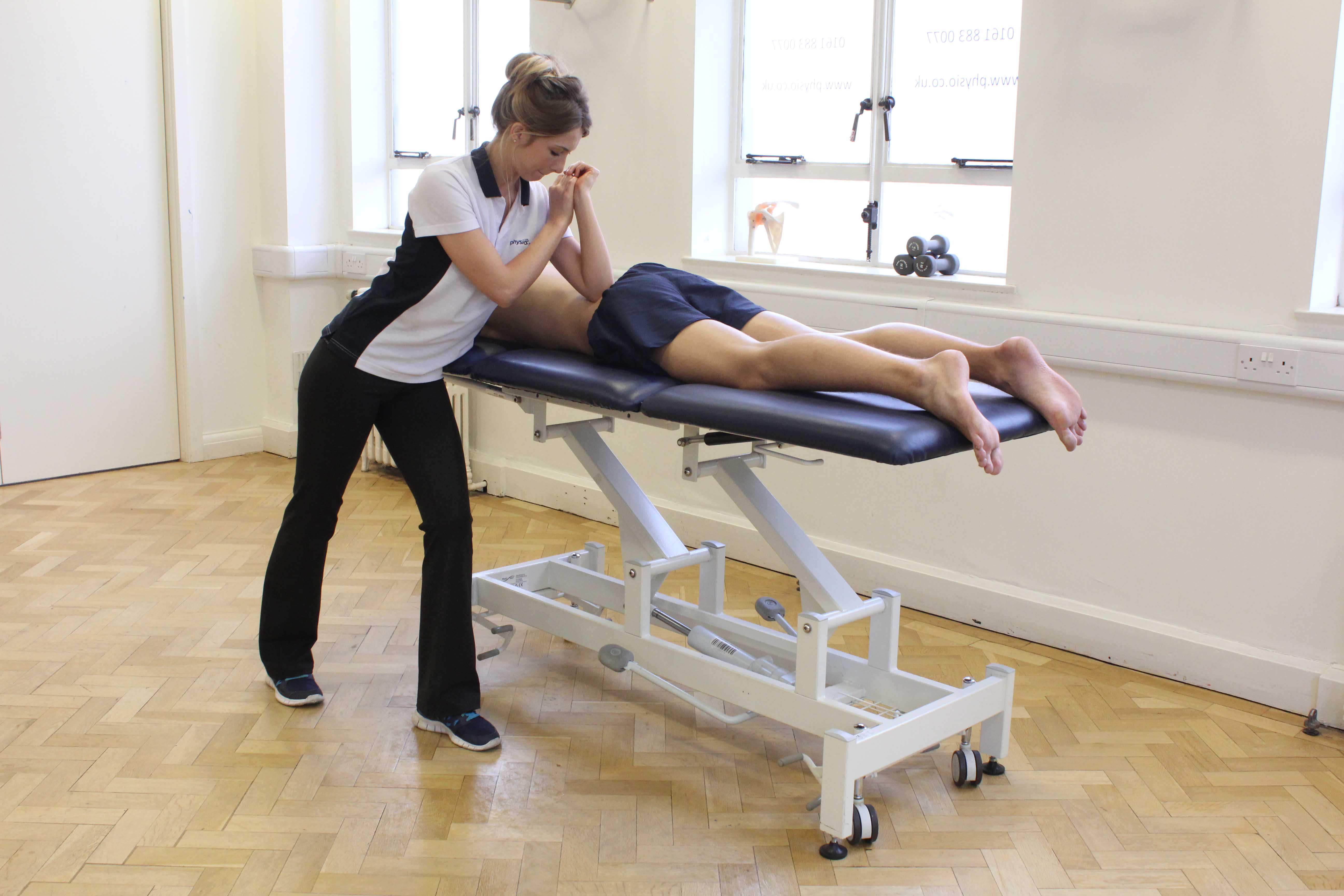 Soft tissue massage of the lower back by a specilaist massage therapist Soft tissue massage of the lower back by a specilaist massage therapist