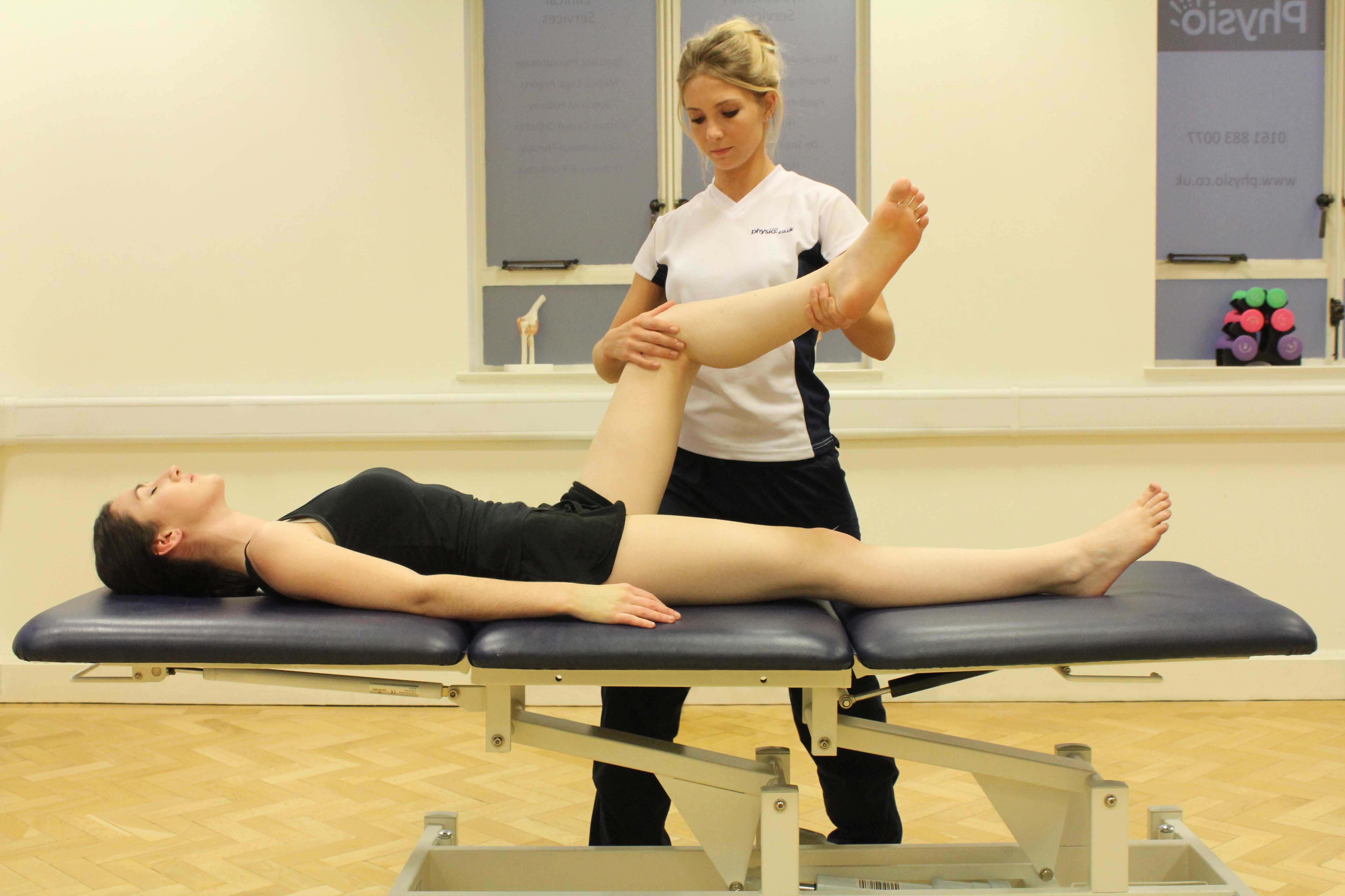 Passive stretch of the muscles and connective tissues of the hip and pelvis by specialist therapist