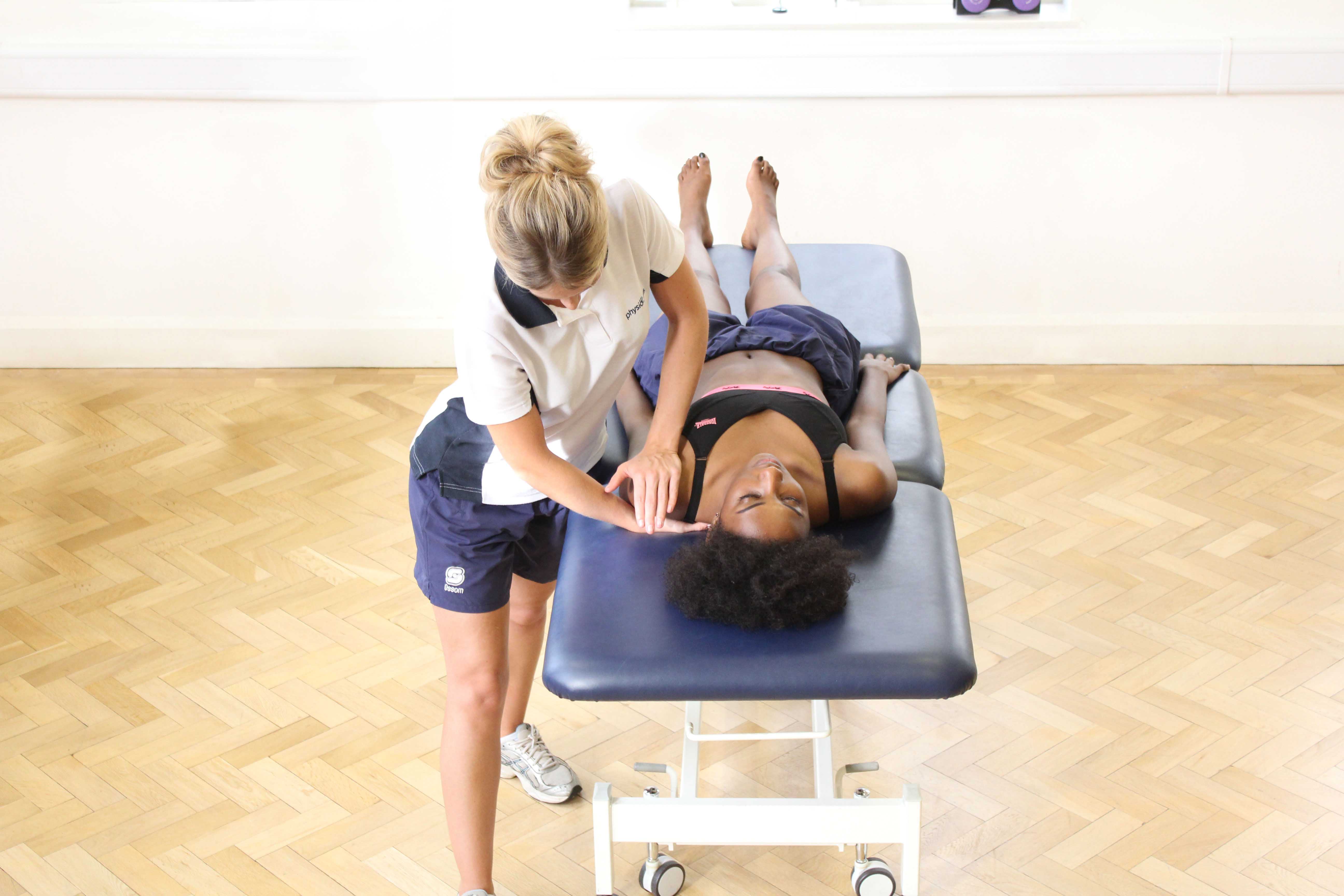 Soft tissue massage of the tricep muscle of the upper arm Soft tissue massage of the tricep muscle of the upper arm