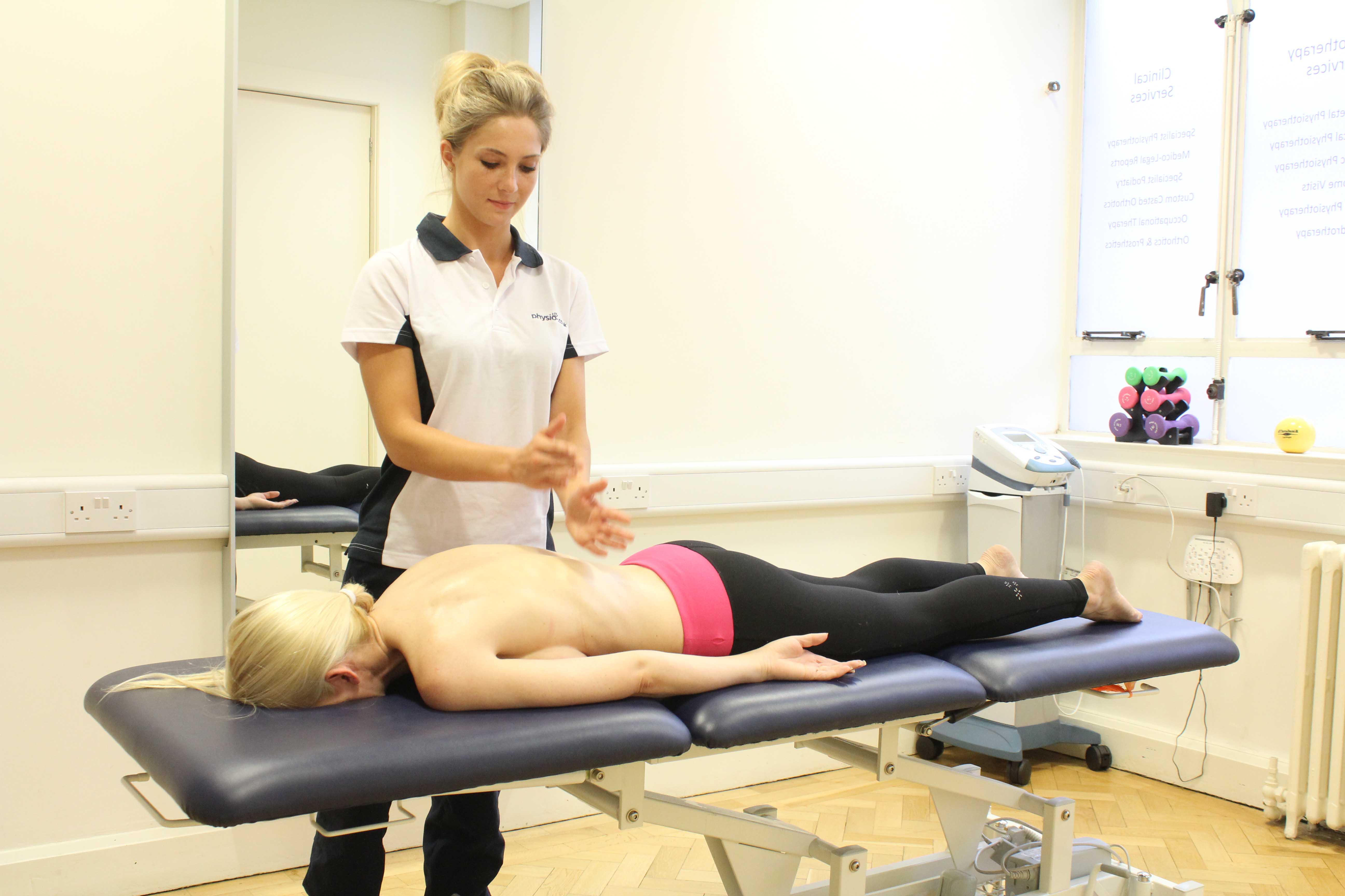 Soft tissue massage of the muscle and connective tissues in the neck by specialist MSK therapist