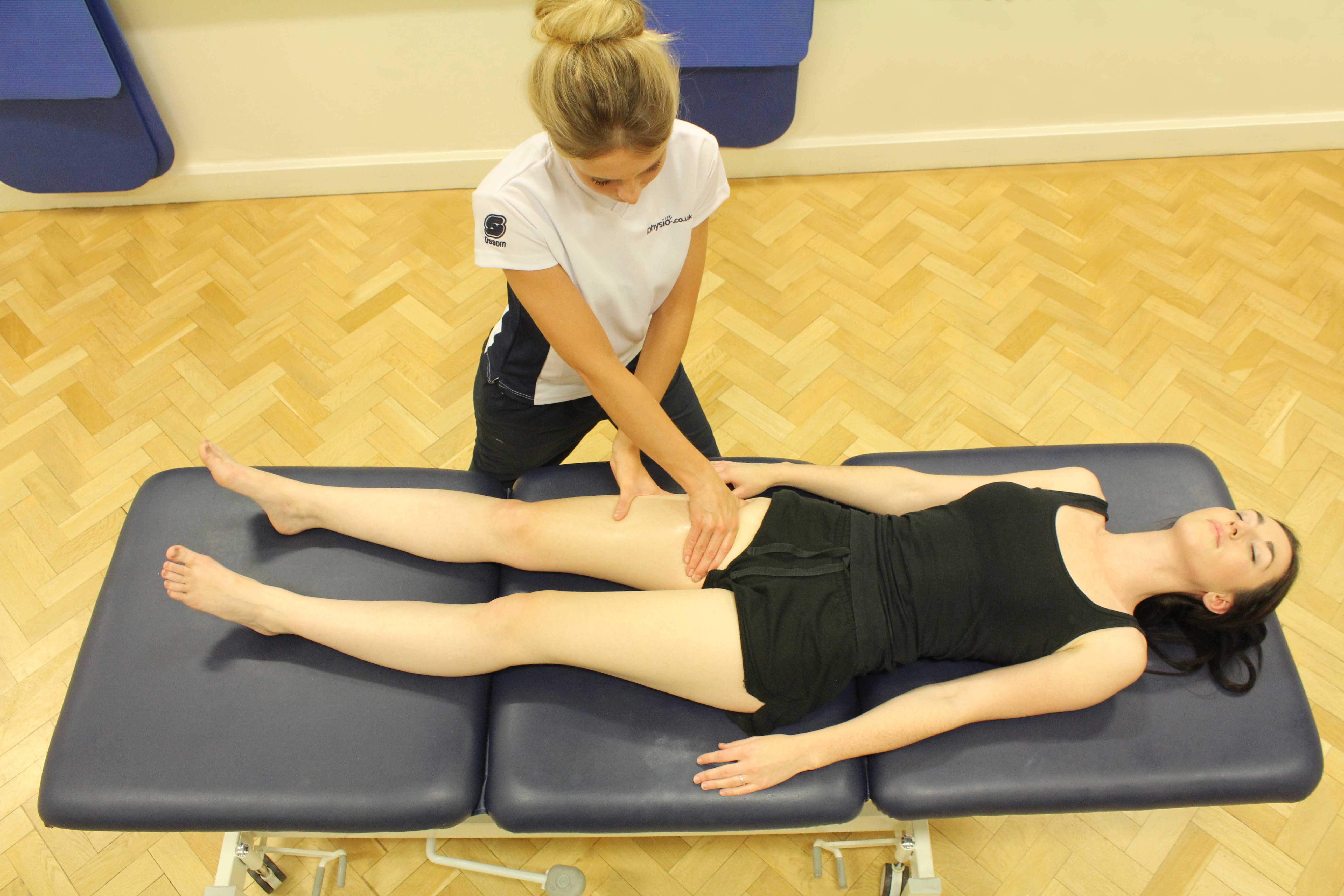 Soft tissue massage of the muscles and connective tissues around the groin by an experienced therapist