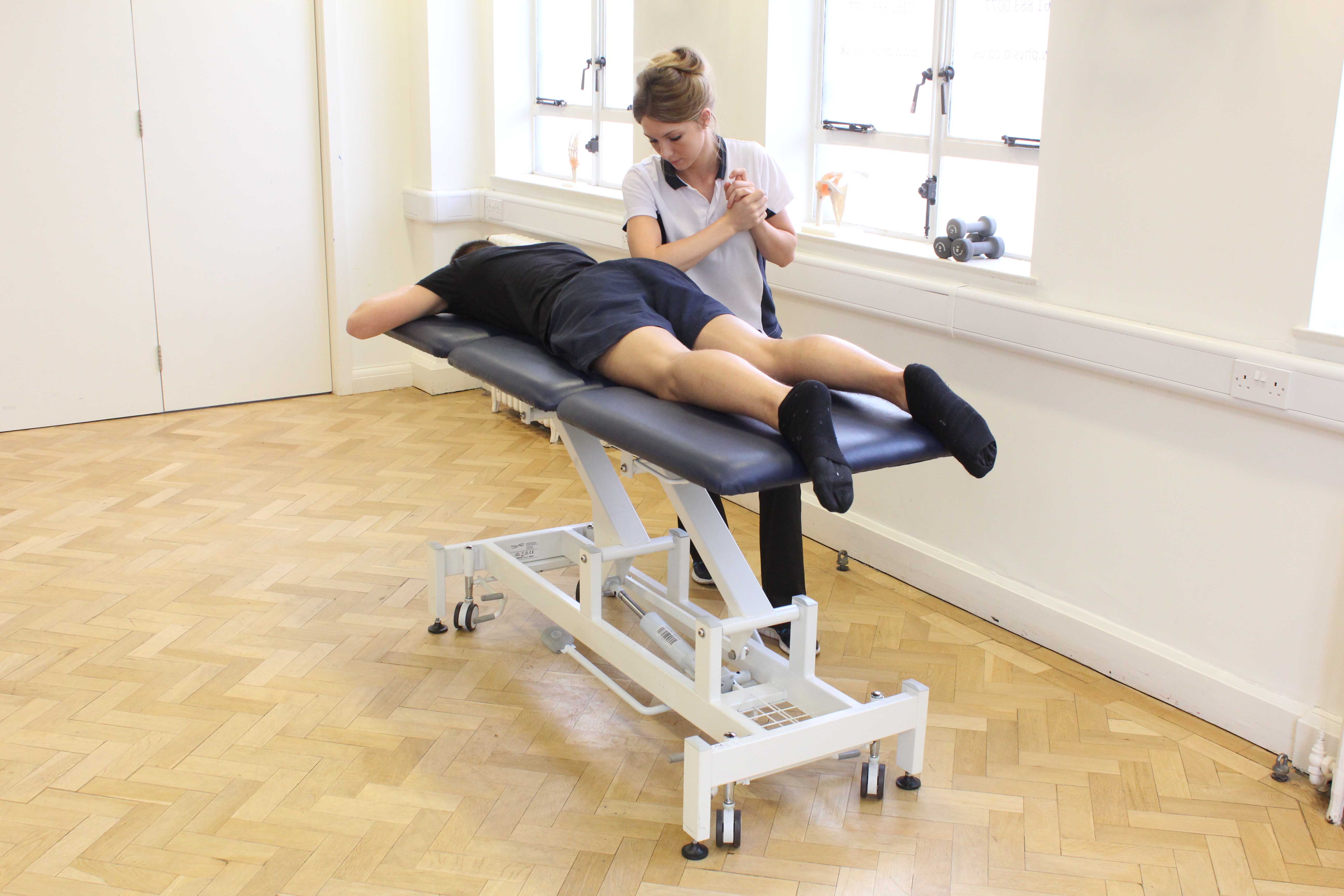 Deep tissue massage of the gluteus maximus muscle by specialist therapist