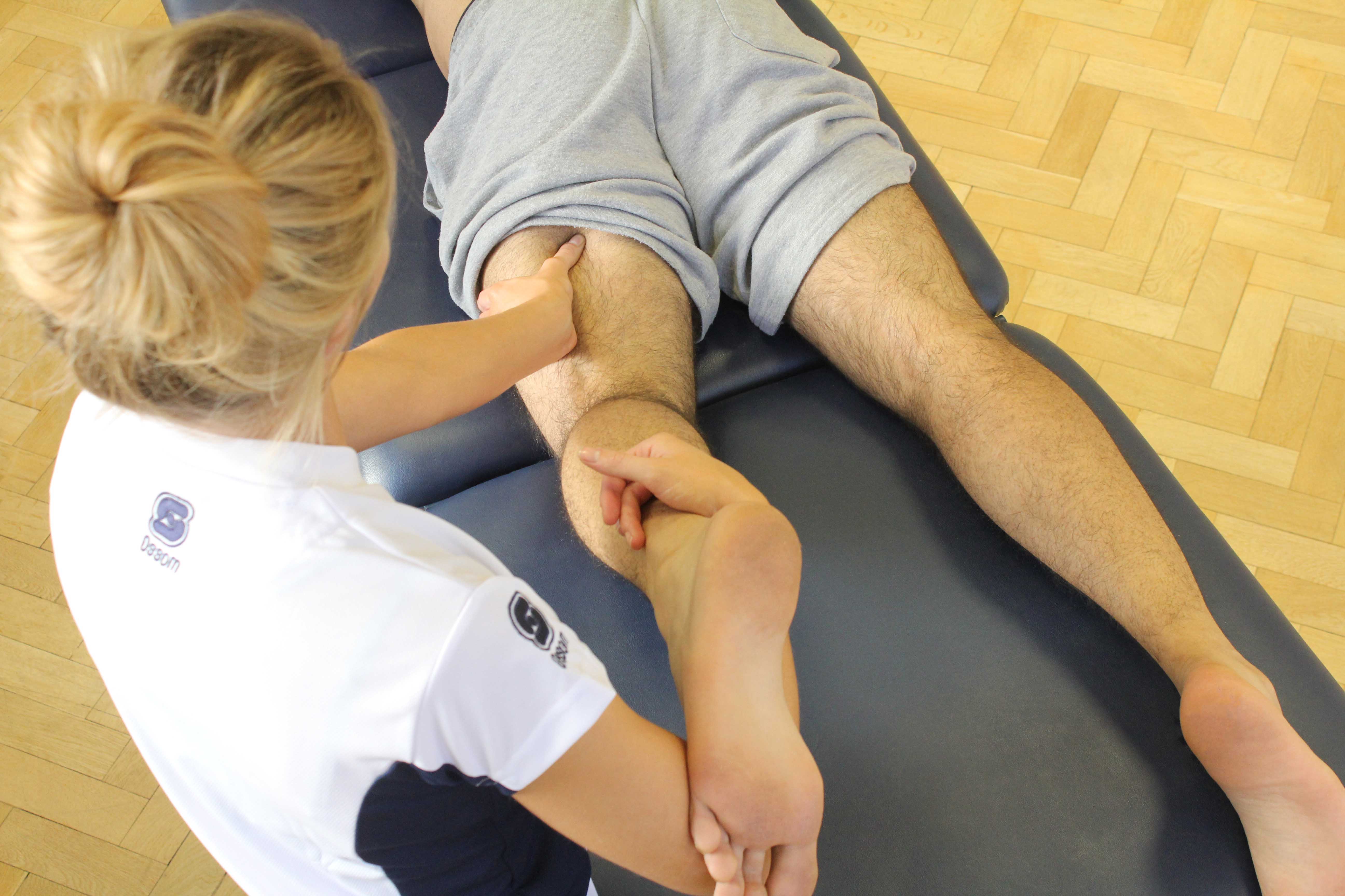 Trigger point massage applied to hamstring muscles Trigger point massage applied to hamstring muscles
