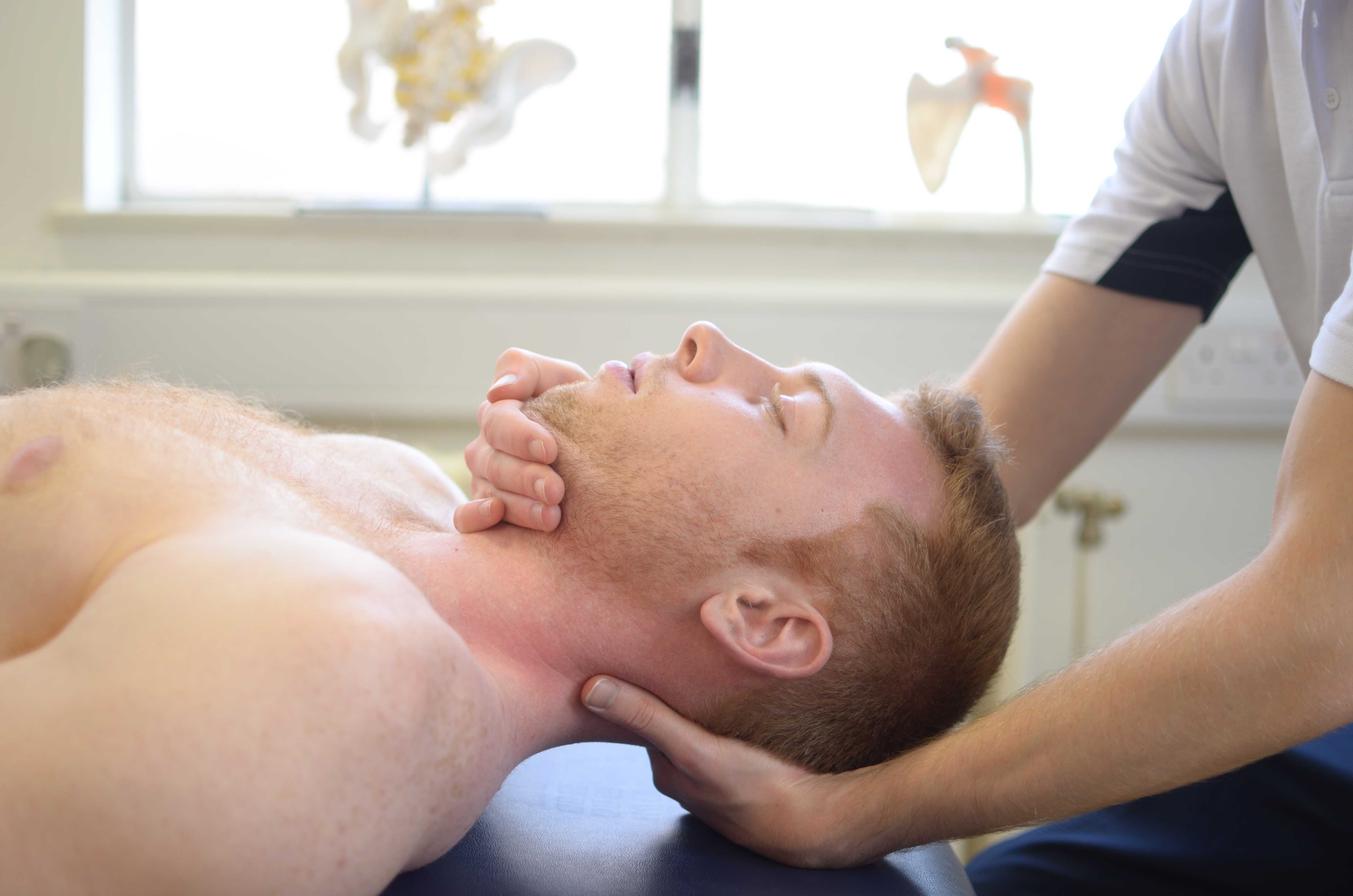 Physiotherapist led mobilisation exercises for the head. Physiotherapist led mobilisation exercises for the head.
