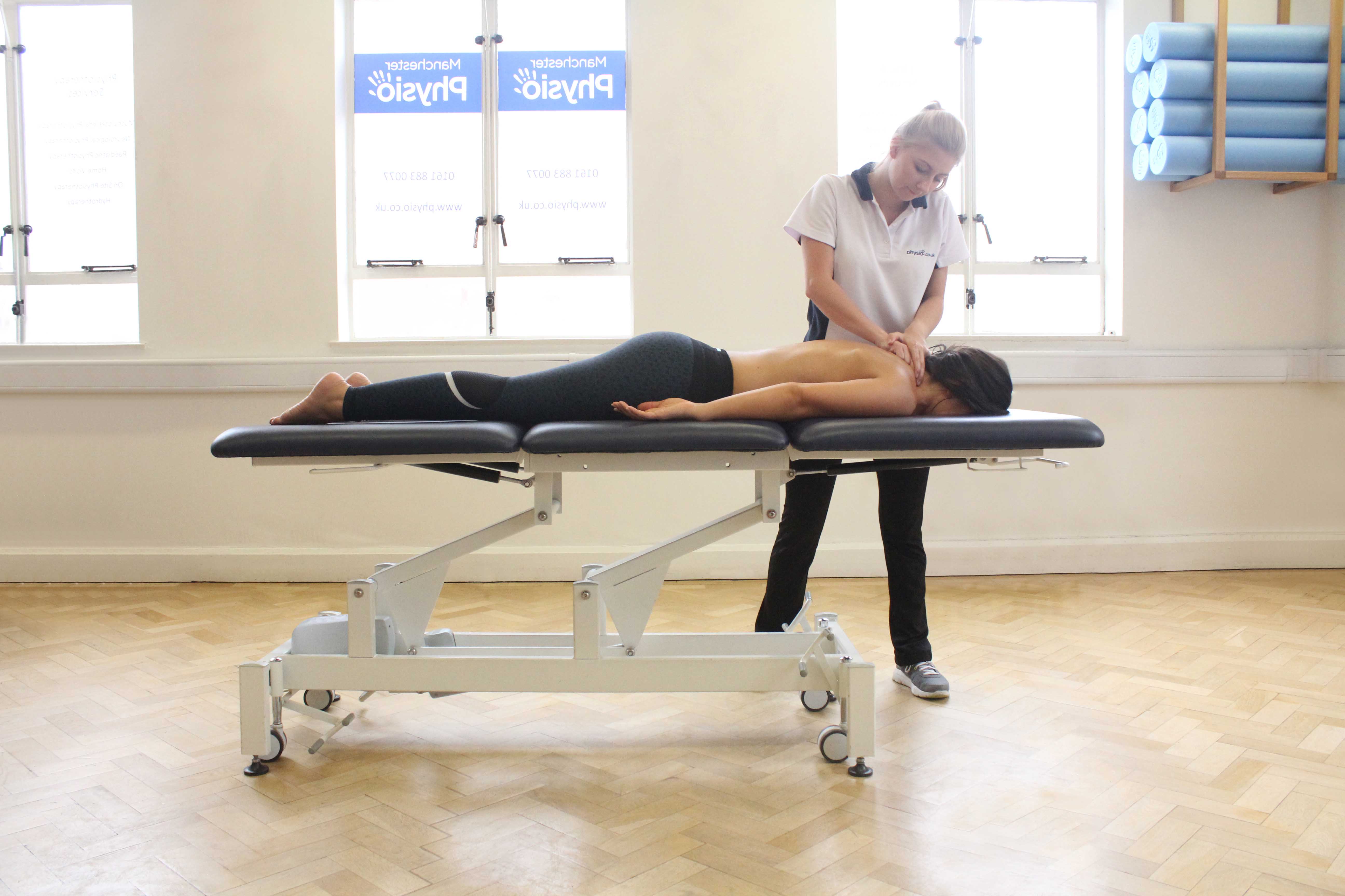 Soft tissue massage applied to trapezius muscles Soft tissue massage applied to trapezius muscles