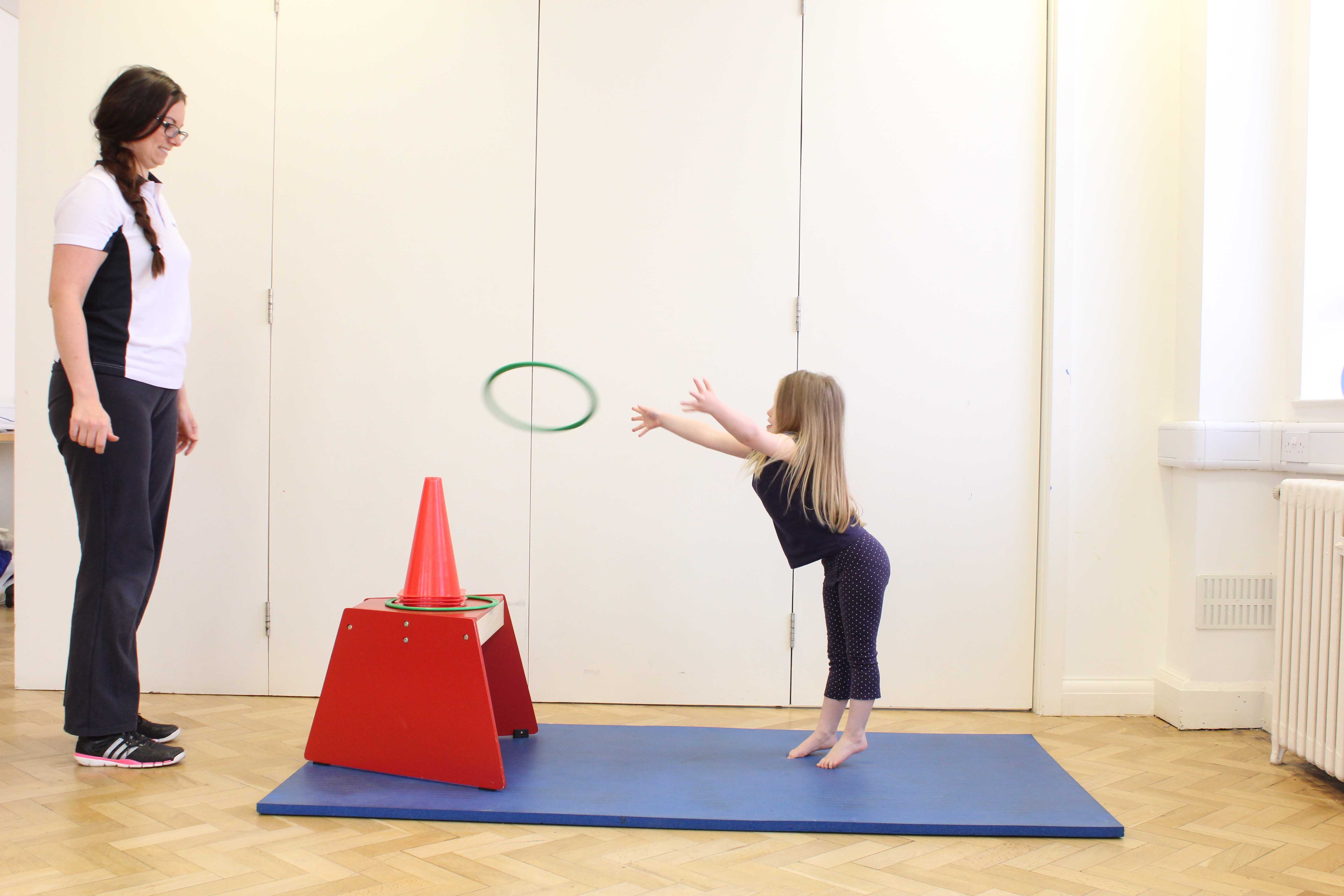 Specialist physiotherapist assisting mobility and co-ordination exercises. Specialist physiotherapist assisting mobility and co-ordination exercises.