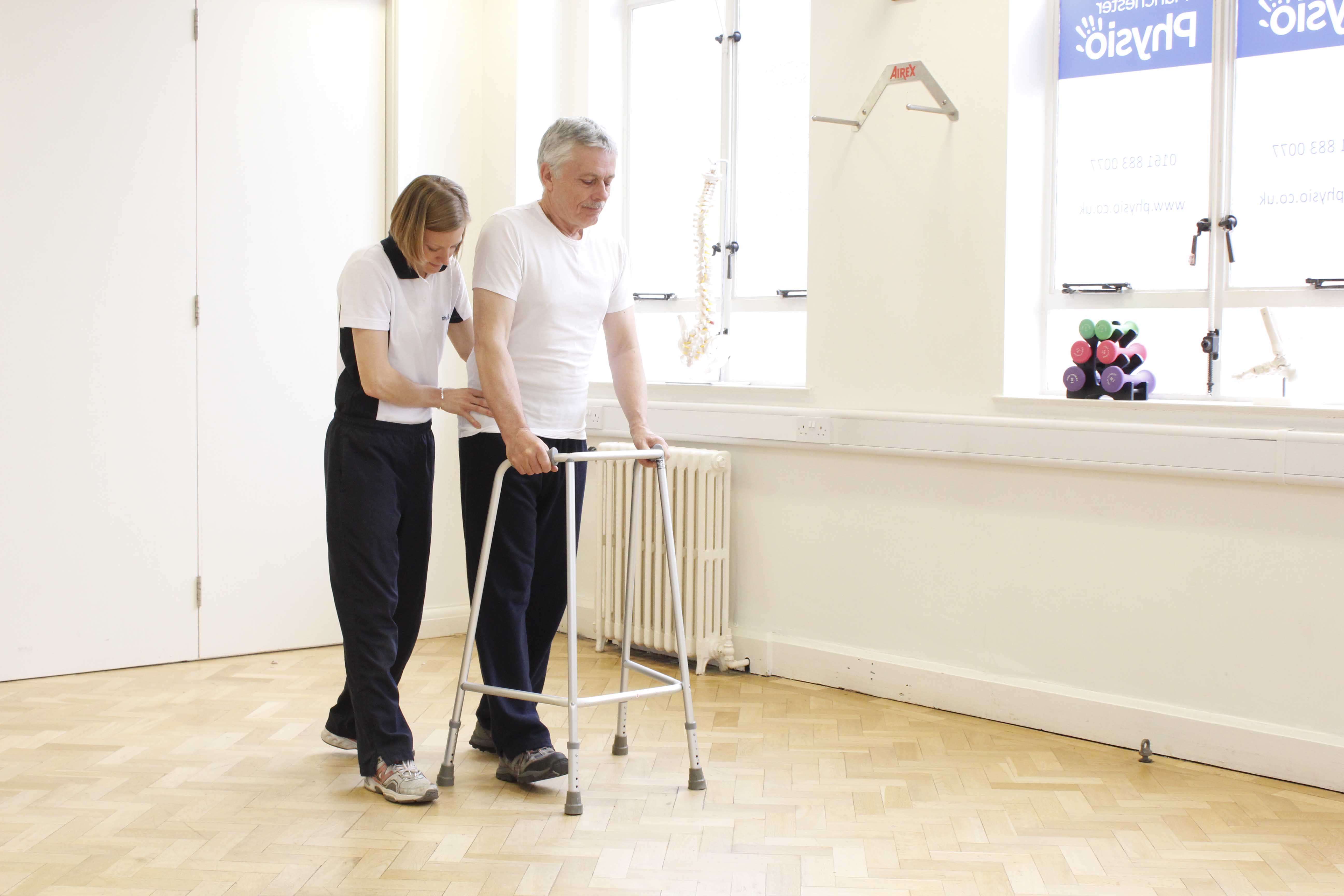 Mobility exercises using a walking frame under the close supervision of an experienced physiotherapist Mobility exercises using a walking frame under the close supervision of an experienced physiotherapist