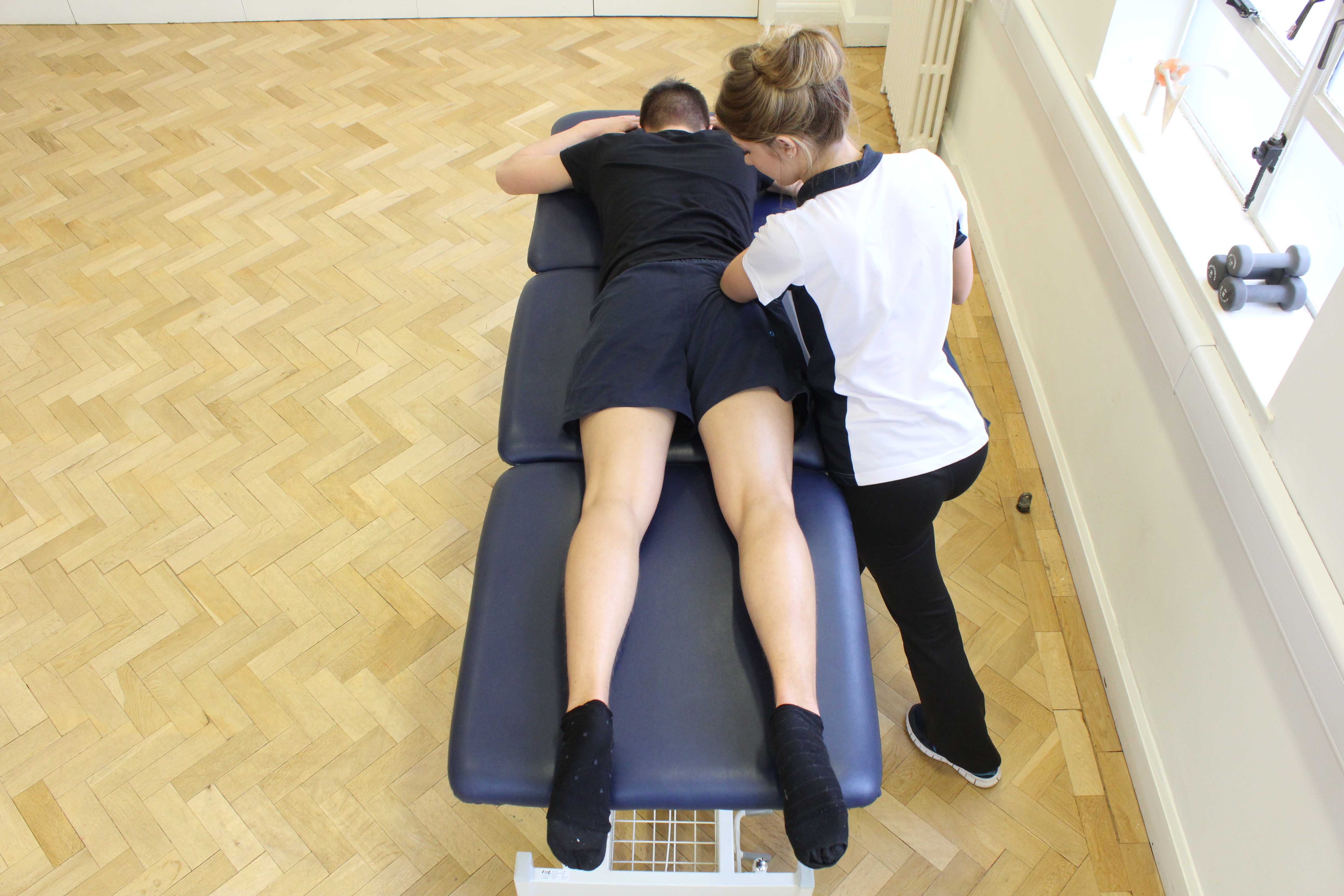 Deep tissue massage of the gluteus muscle by specialist MSK therapist Deep tissue massage of the gluteus muscle by specialist MSK therapist