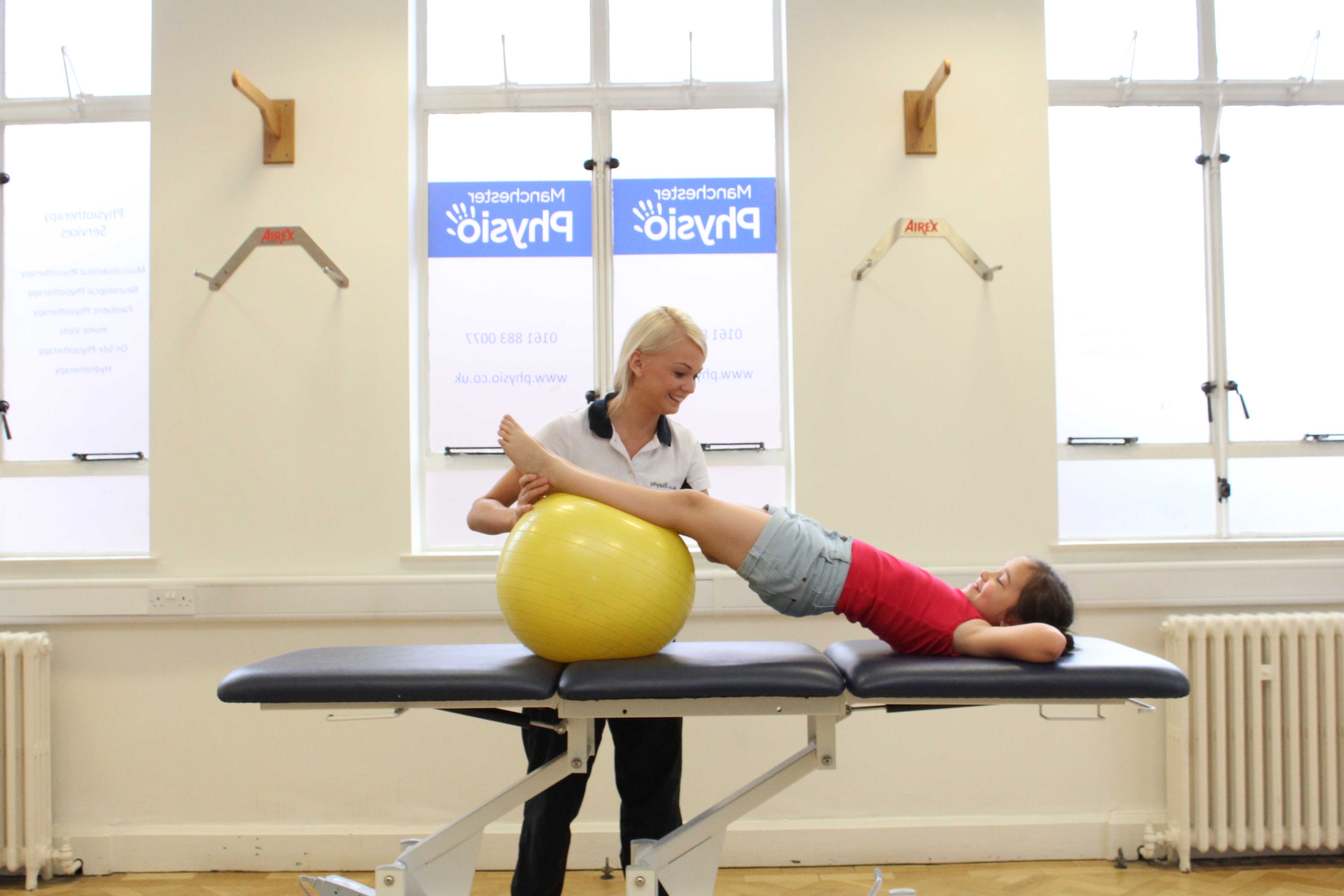 Core strength bridging exercise under close supervision of physiotherapist Core strength bridging exercise under close supervision of physiotherapist
