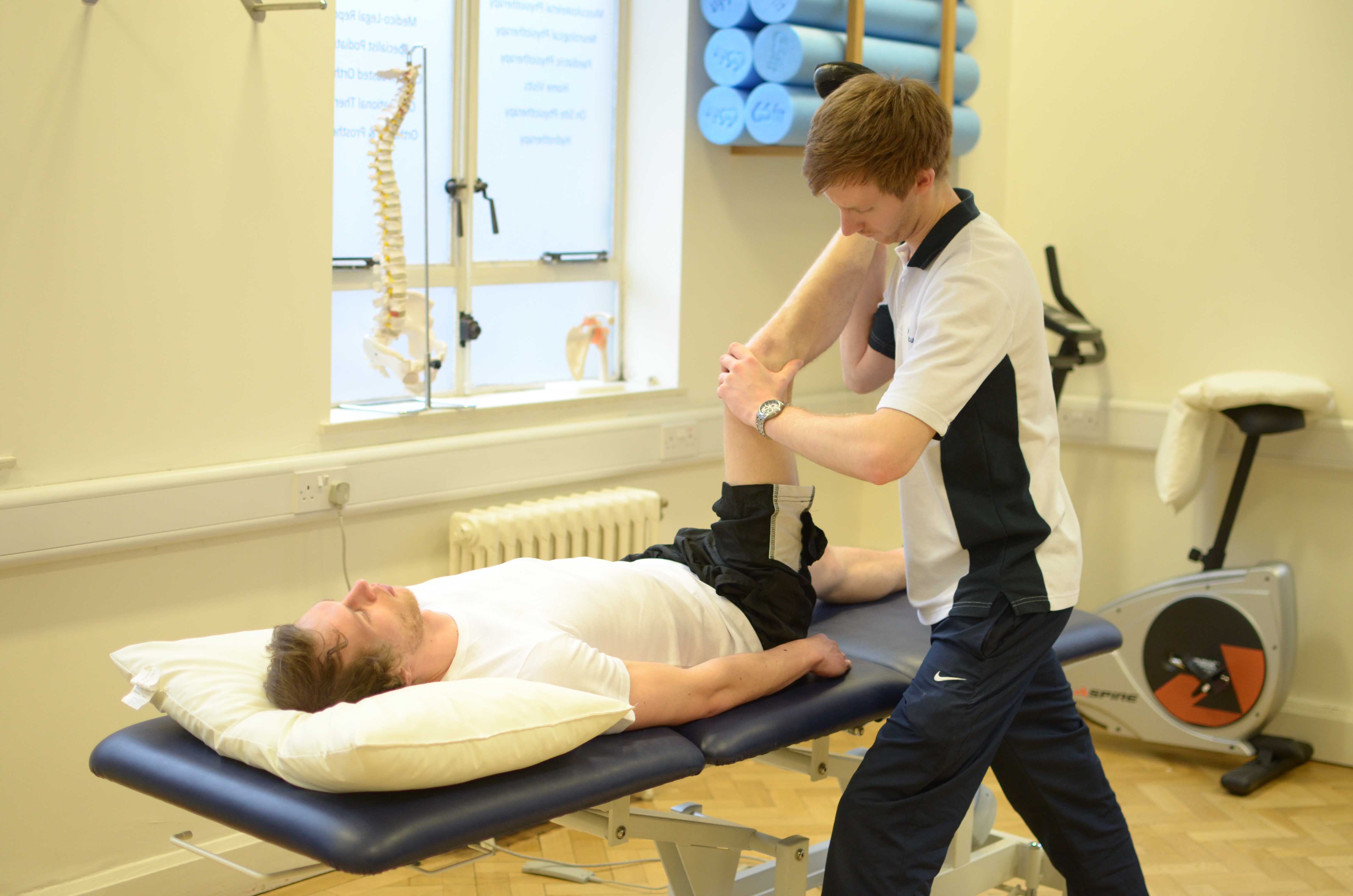 Passive stretch test of hamstring and calf muscles conducted by physiotherapist Passive stretch test of hamstring and calf muscles conducted by physiotherapist