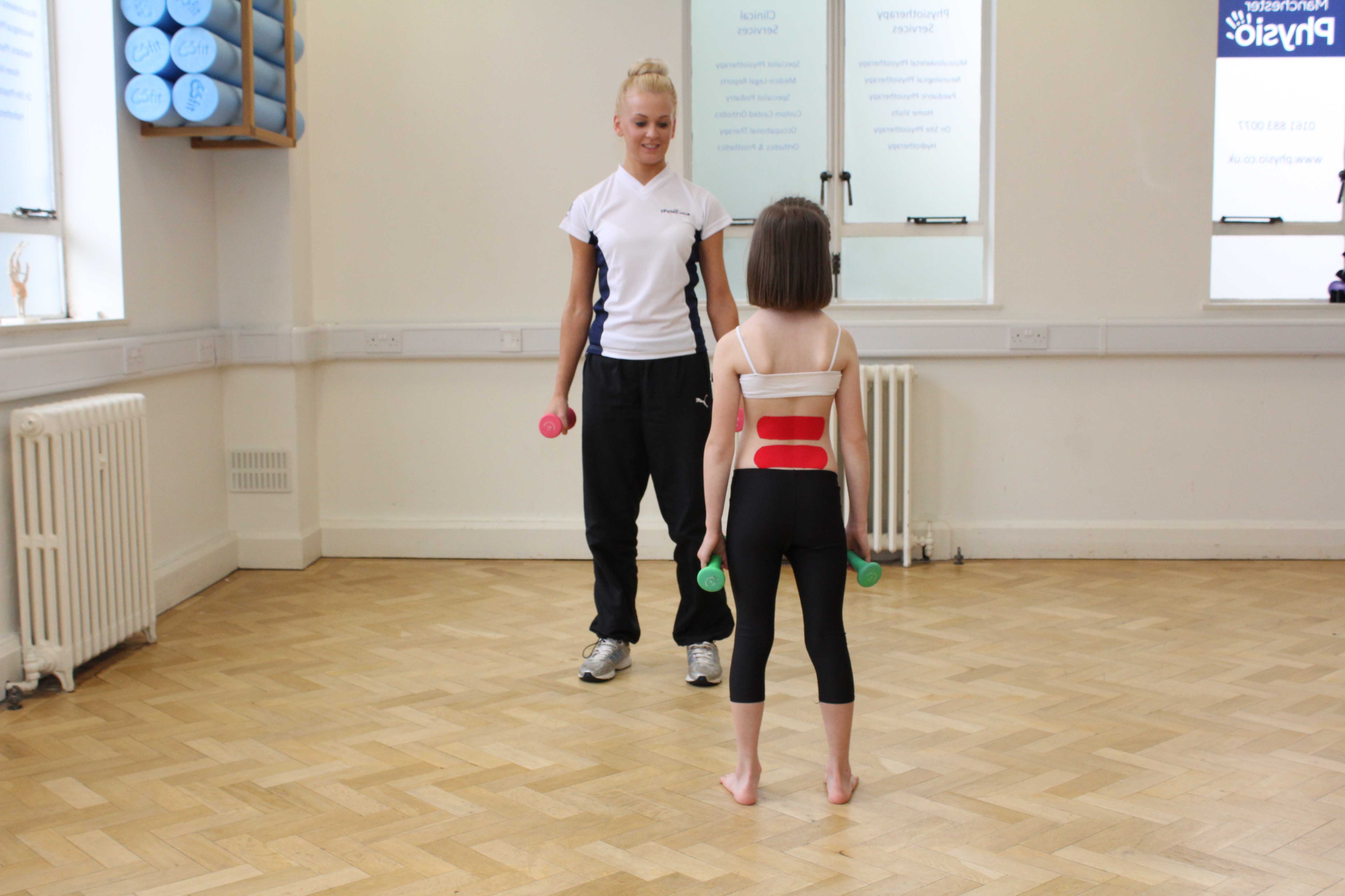 Kinesio tape used to support weakened tissues during rehabilitation exercises Kinesio tape used to support weakened tissues during rehabilitation exercises