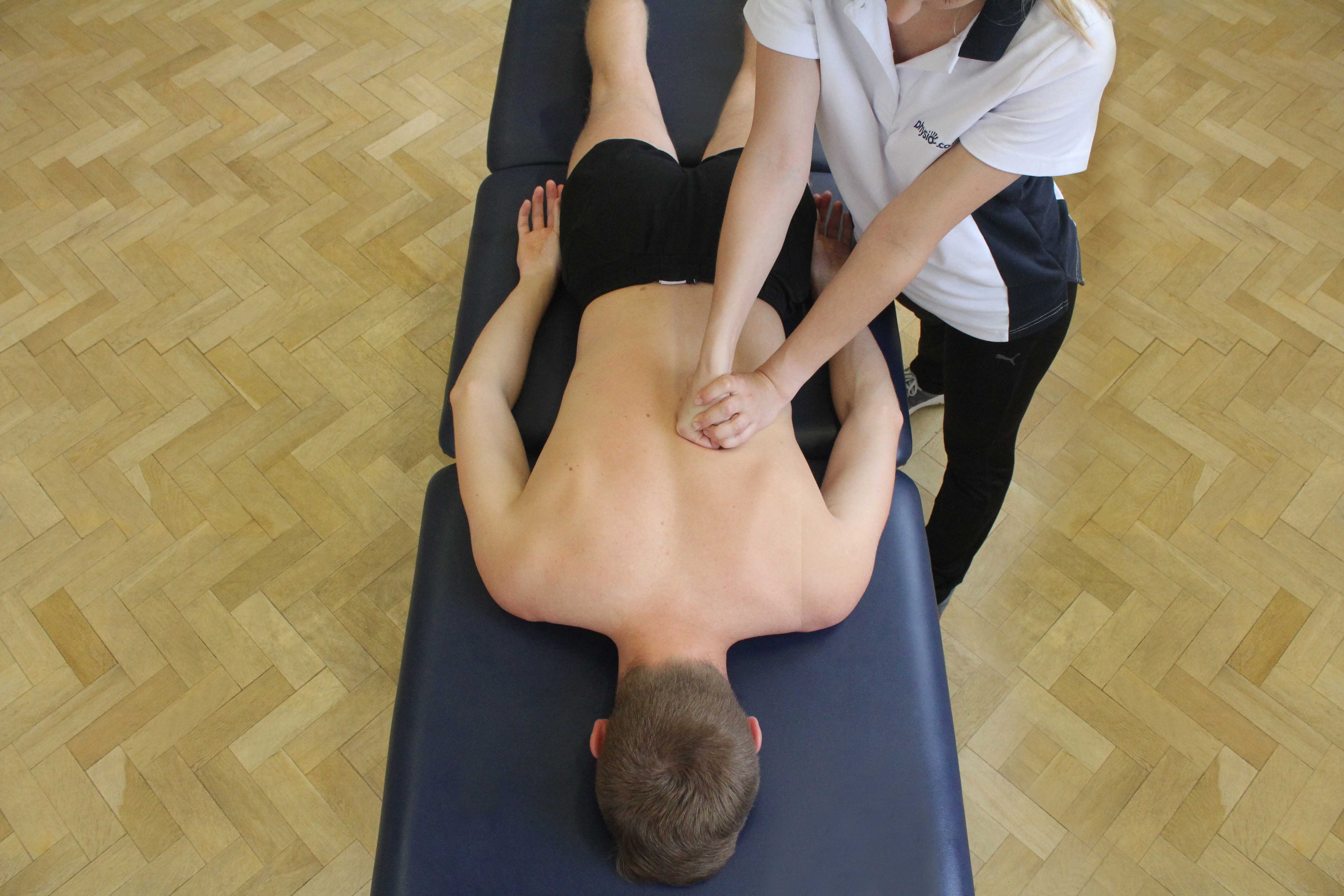 Kneading massage technique applied to Latissimus dorsi and erector spinae muscles