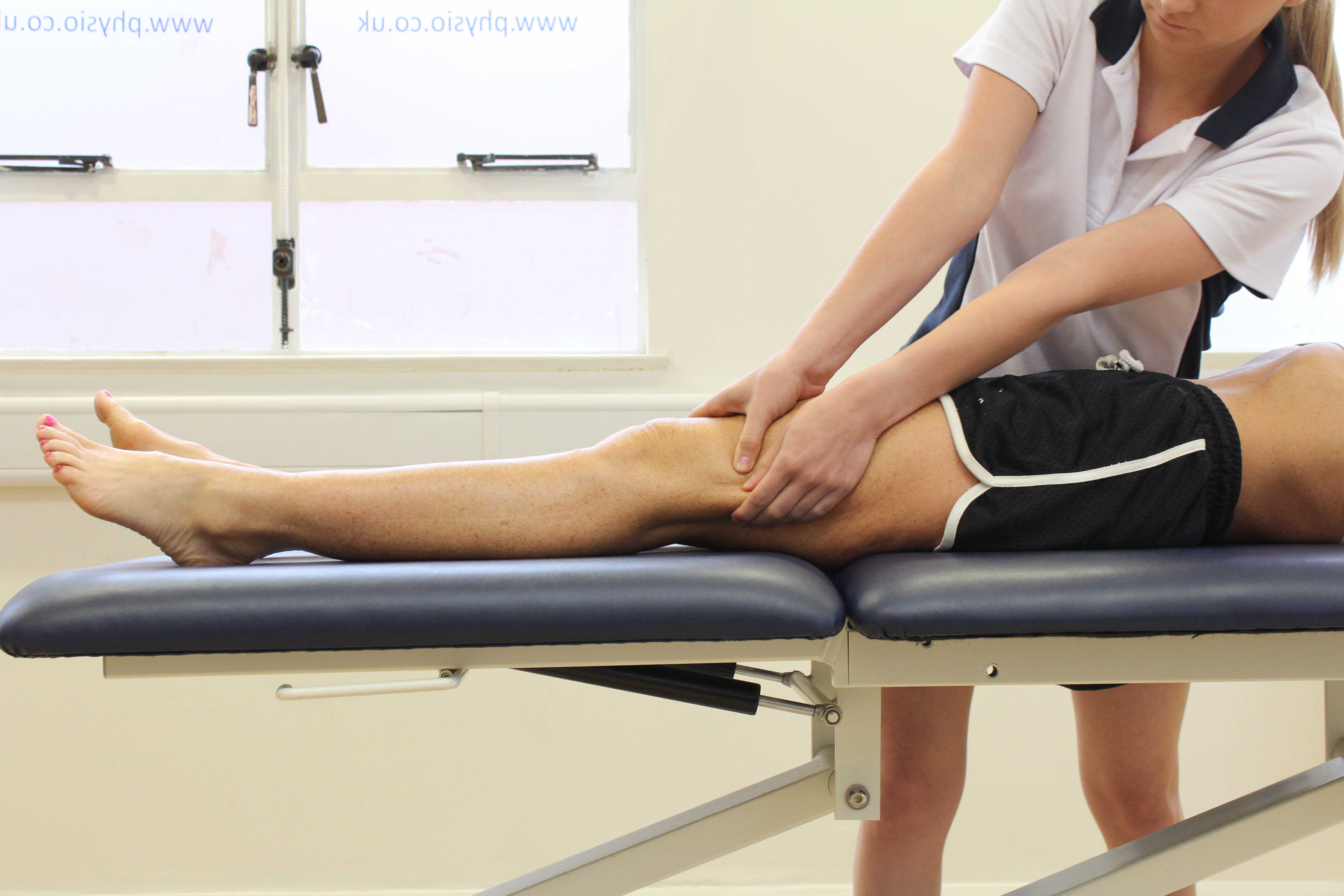 Soft tissue massage of the muscle and connective tissues around the knee Soft tissue massage of the muscle and connective tissues around the knee
