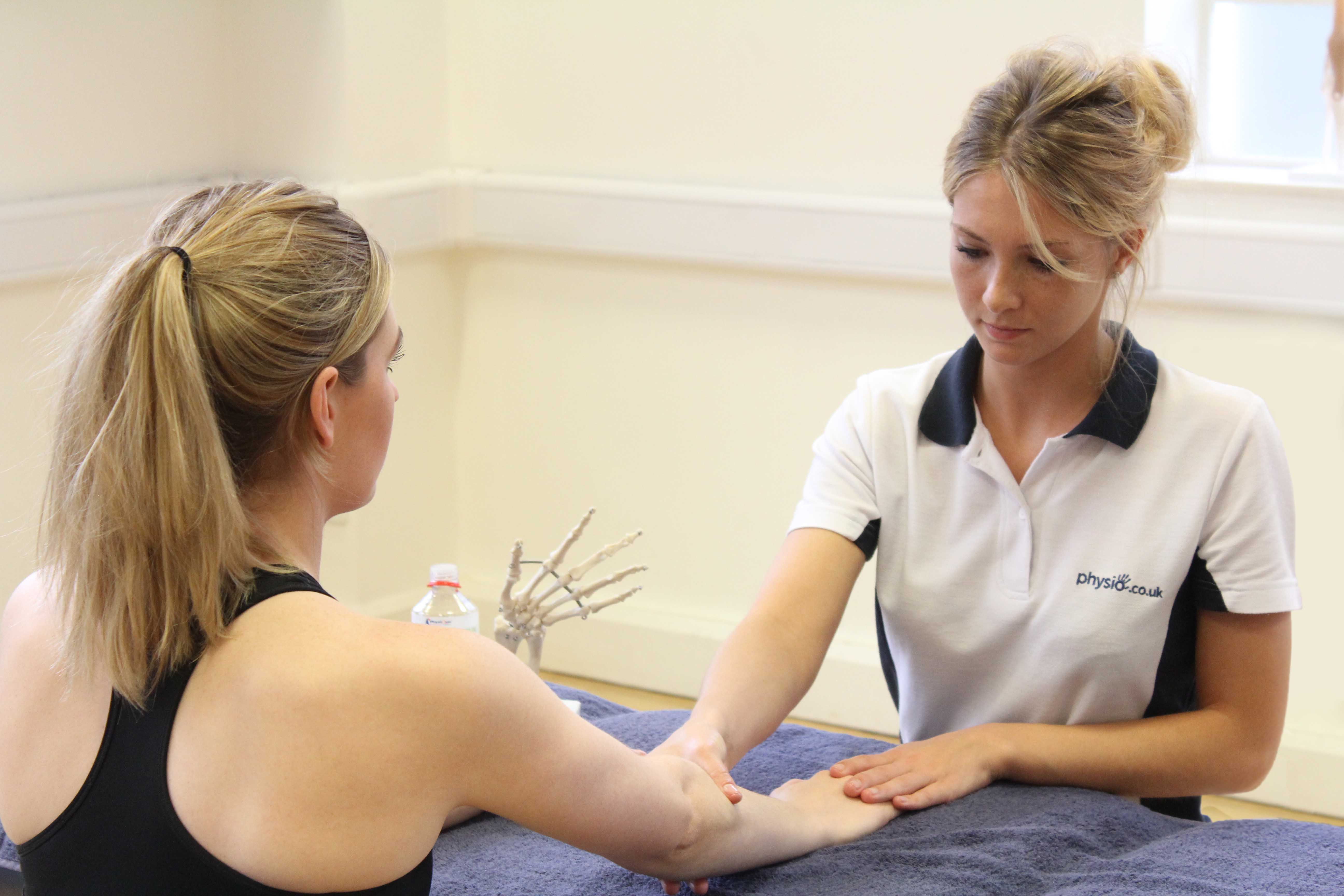 Soft tissue massage of the the connective tissues around the elbow
