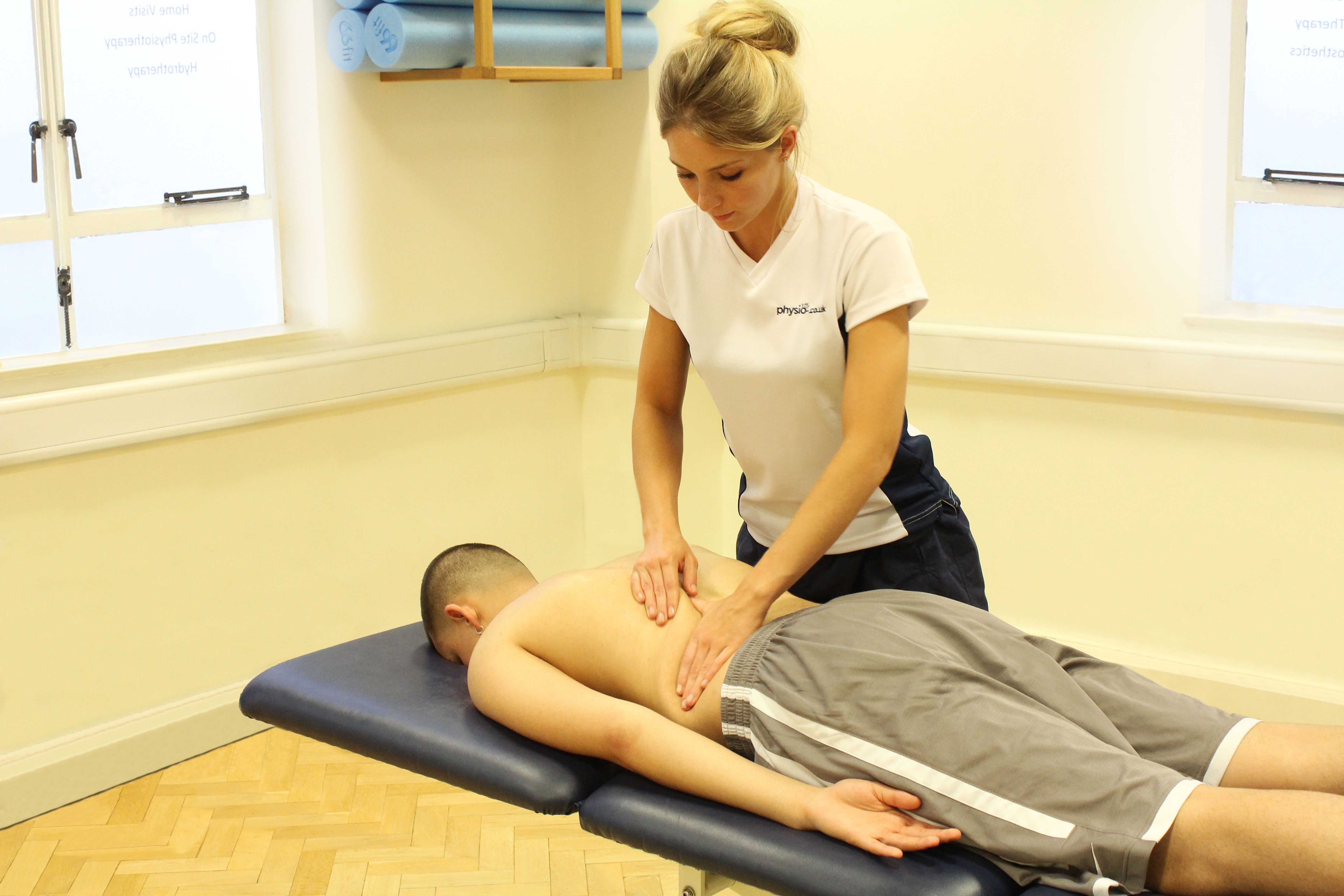 Rolling Soft Tissue Massage applied to the lower back by experienced therapist