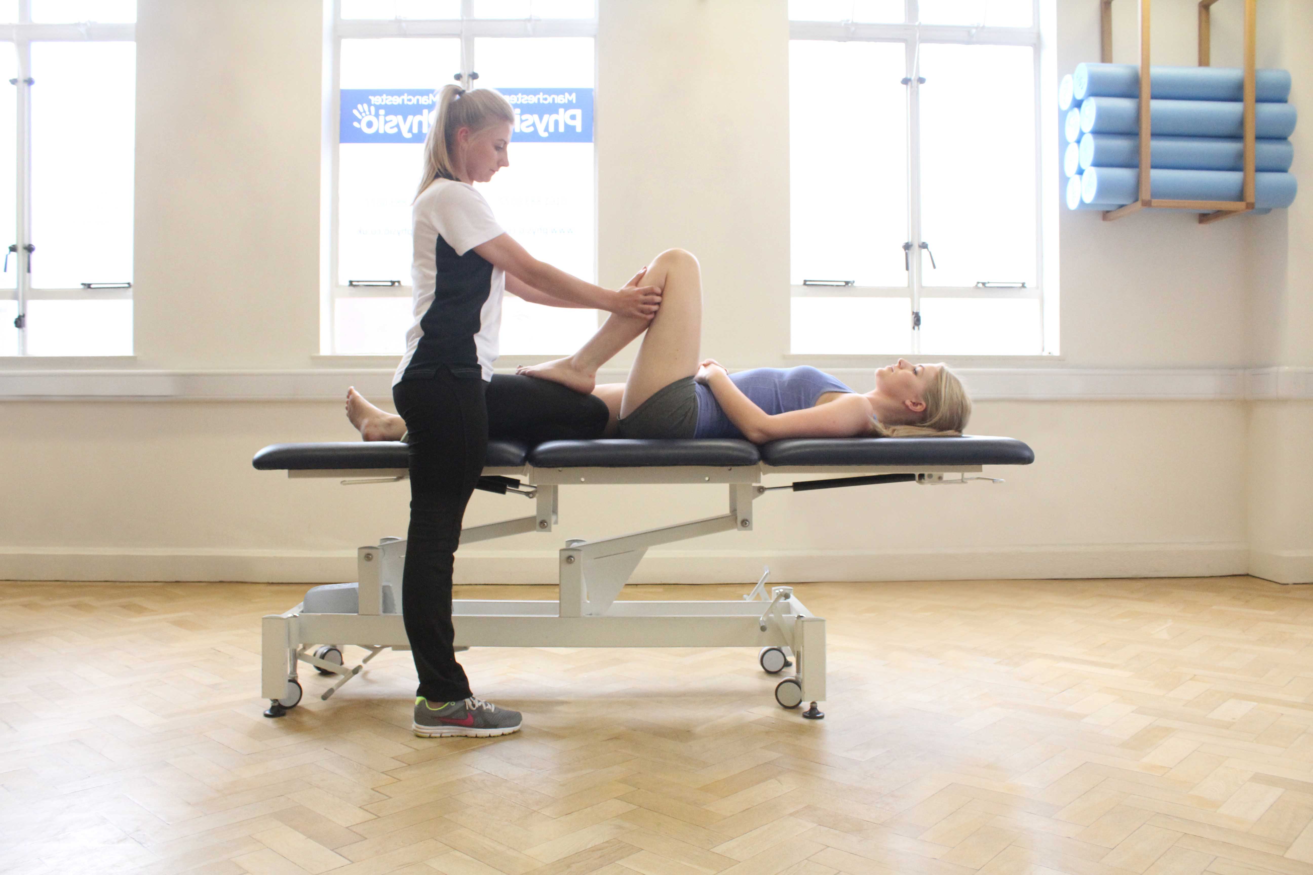 Massage and mobilisations of the knee joint by specialist physiotherapist Massage and mobilisations of the knee joint by specialist physiotherapist