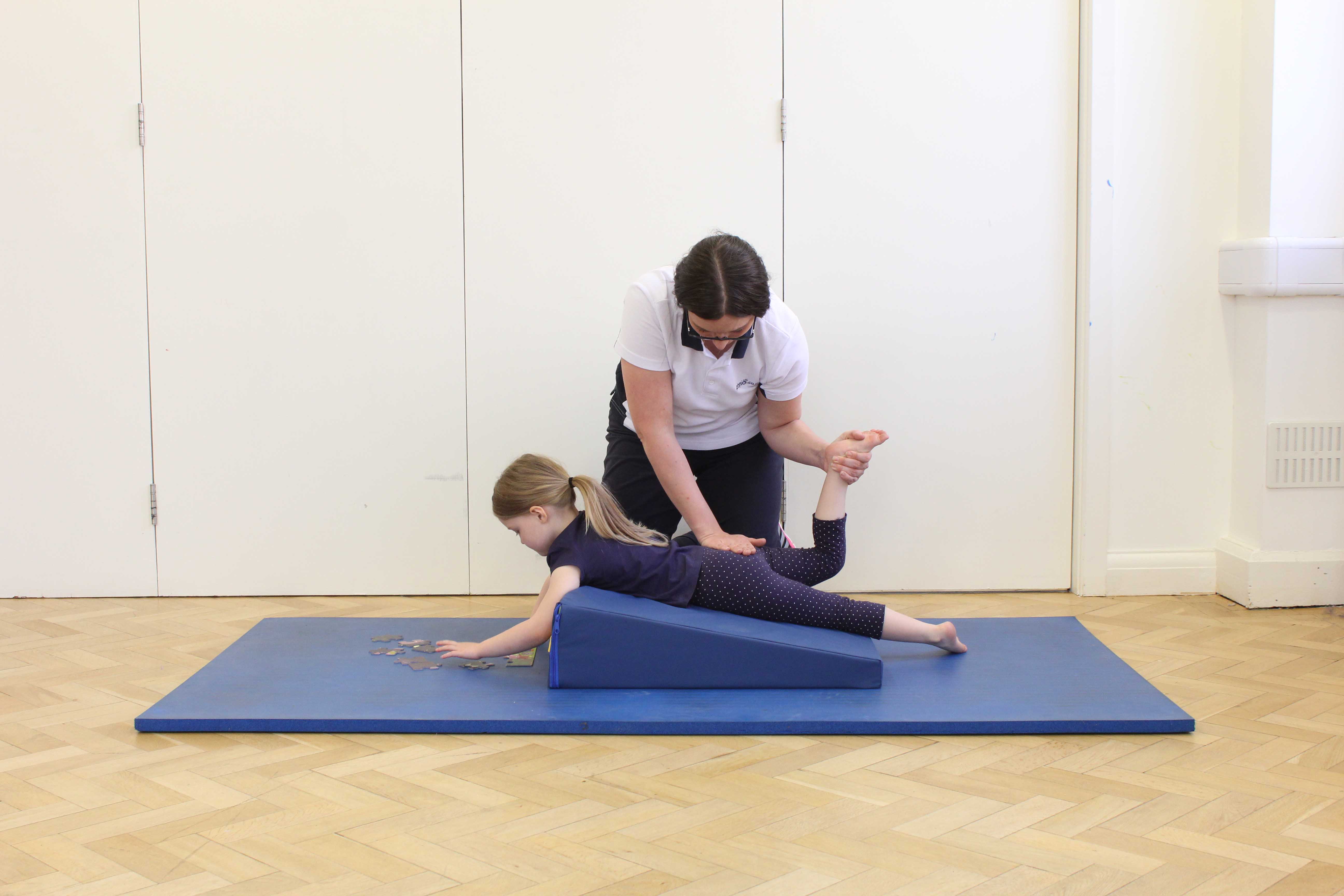 Massage and stretches of the hip and knee applied by a specialist paediatric physiotherapist Massage and stretches of the hip and knee applied by a specialist paediatric physiotherapist