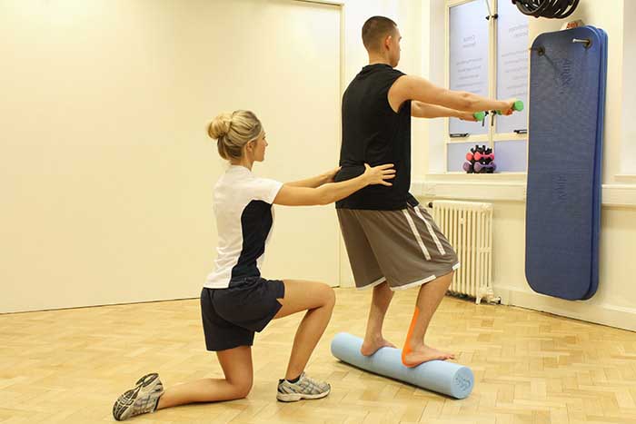 Customer receiving balance training by instructor Customer receiving balance training by instructor