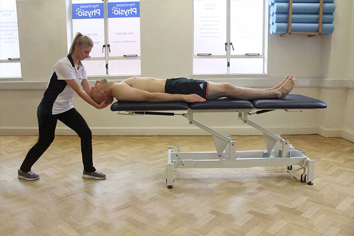 Customer receiving head massage in Manchester Physio Clinic Customer reciving head massage in Manchester Physio Clinic