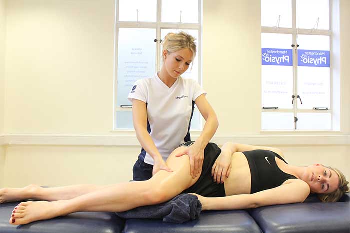 Customer reciving thigh massage to improve blood circulation Customer reciving thigh massage to improve blood circulation