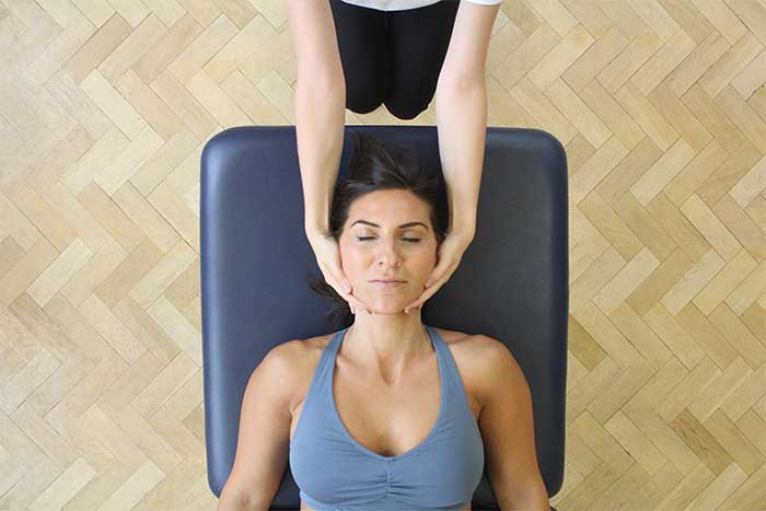 Customer reciving a jaw massage while in a relaxed position in Manchester Physio Clinic