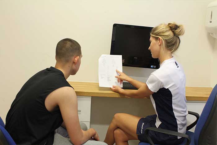 Customer receiving guidance from instructor Customer receiving guidance from instructor