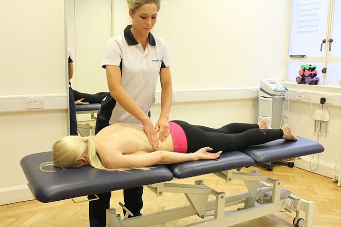 Customer receiving lower back massage in Manchester Physio Clinic Customer receiving lower back massage in Manchester Physio Clinic