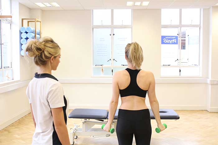 Customer using weights to help gain arm muscle to reduce spasms