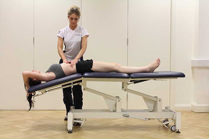 Customer receiving an abdominal massage while in a relaxed position in Manchester Physio Clinic Customer receiving an abdominal massage while in a relaxed position in Manchester Physio Clinic